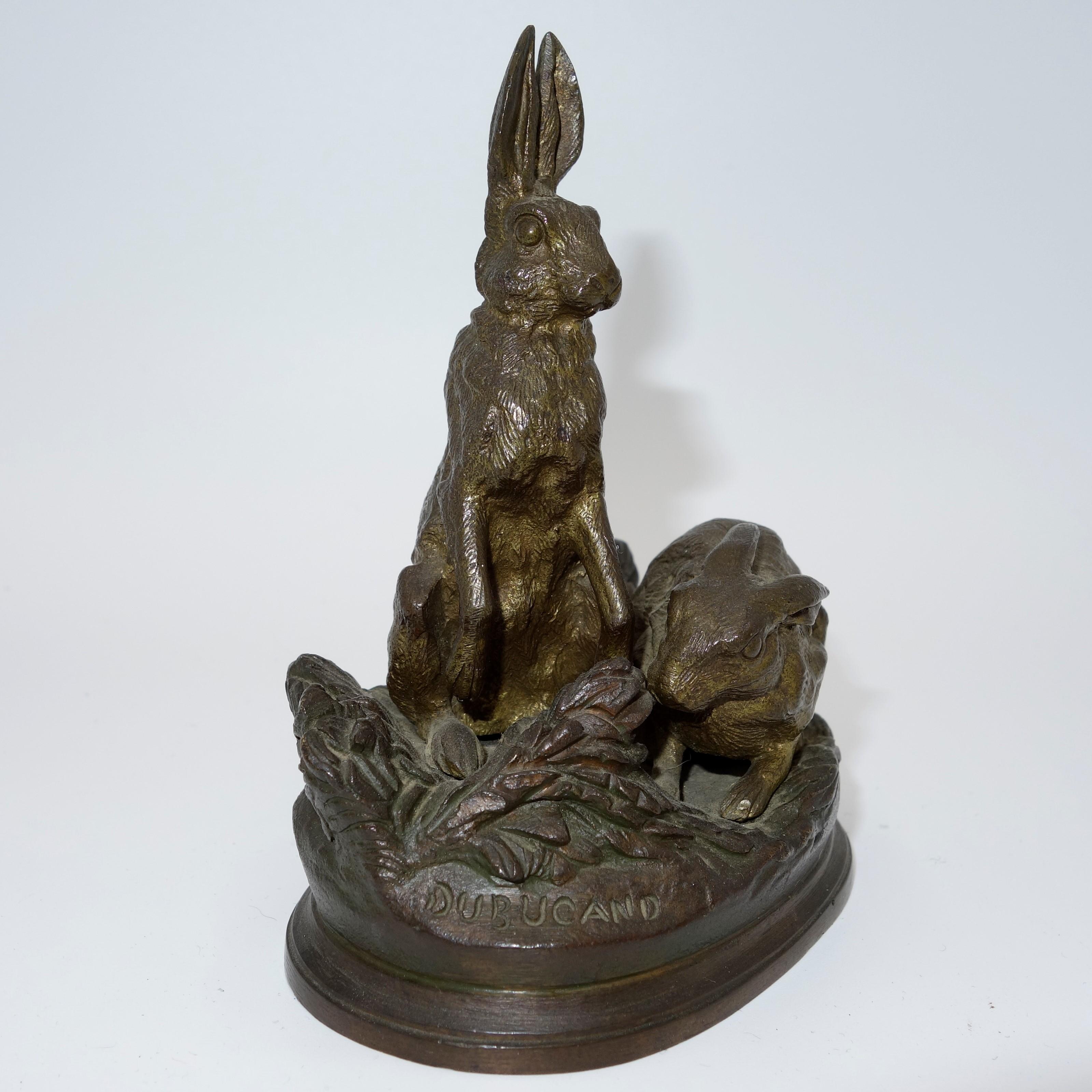 French 19th century Animalier bronze of Two Hares on a naturalistic base - Sculpture by Alfred Dubucand