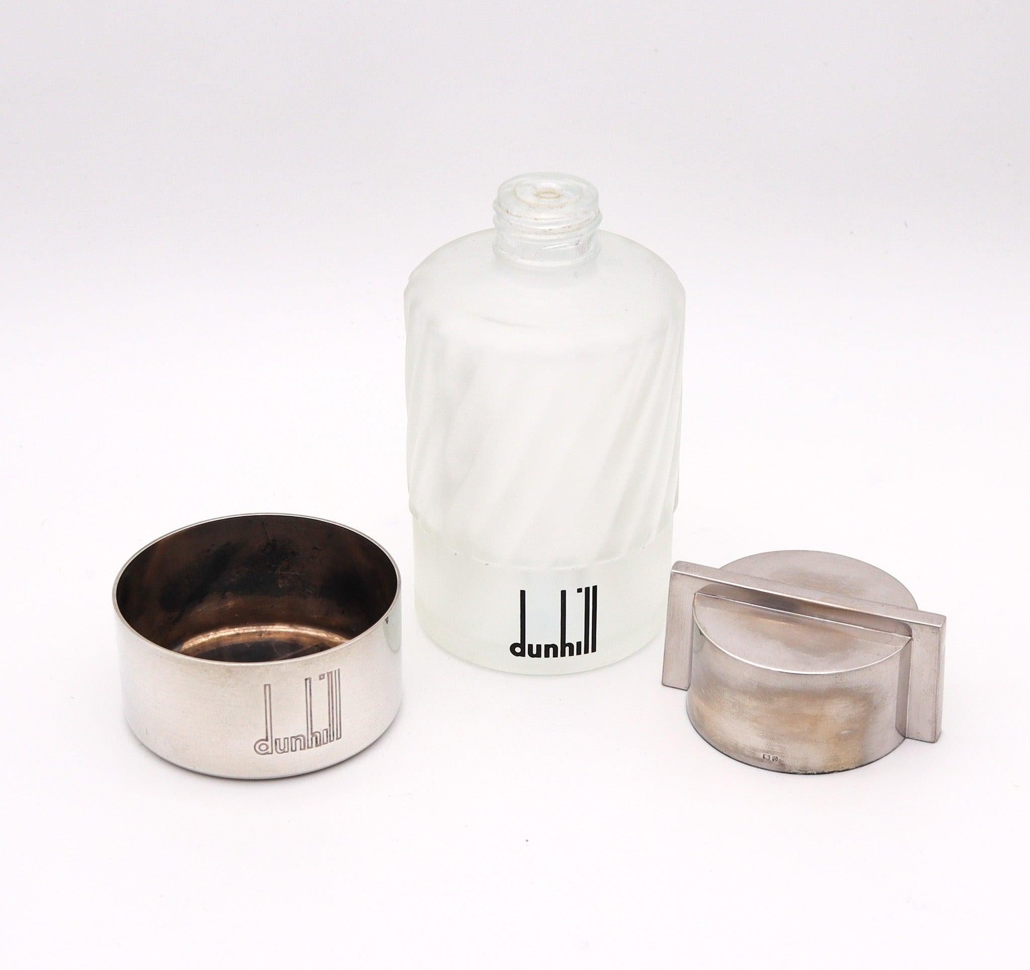 A perfume bottle designed by Alfred Dunhill.

This is a beautiful perfume bottle, created in London England by the Alfred Dunhill Company, back in the 1986. The perfume bottle has been crafted in frosted glass with fluted patterns and parts in solid