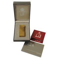 Encendedor RollGas bañado en oro Alfred Dunhill con caja y papeles