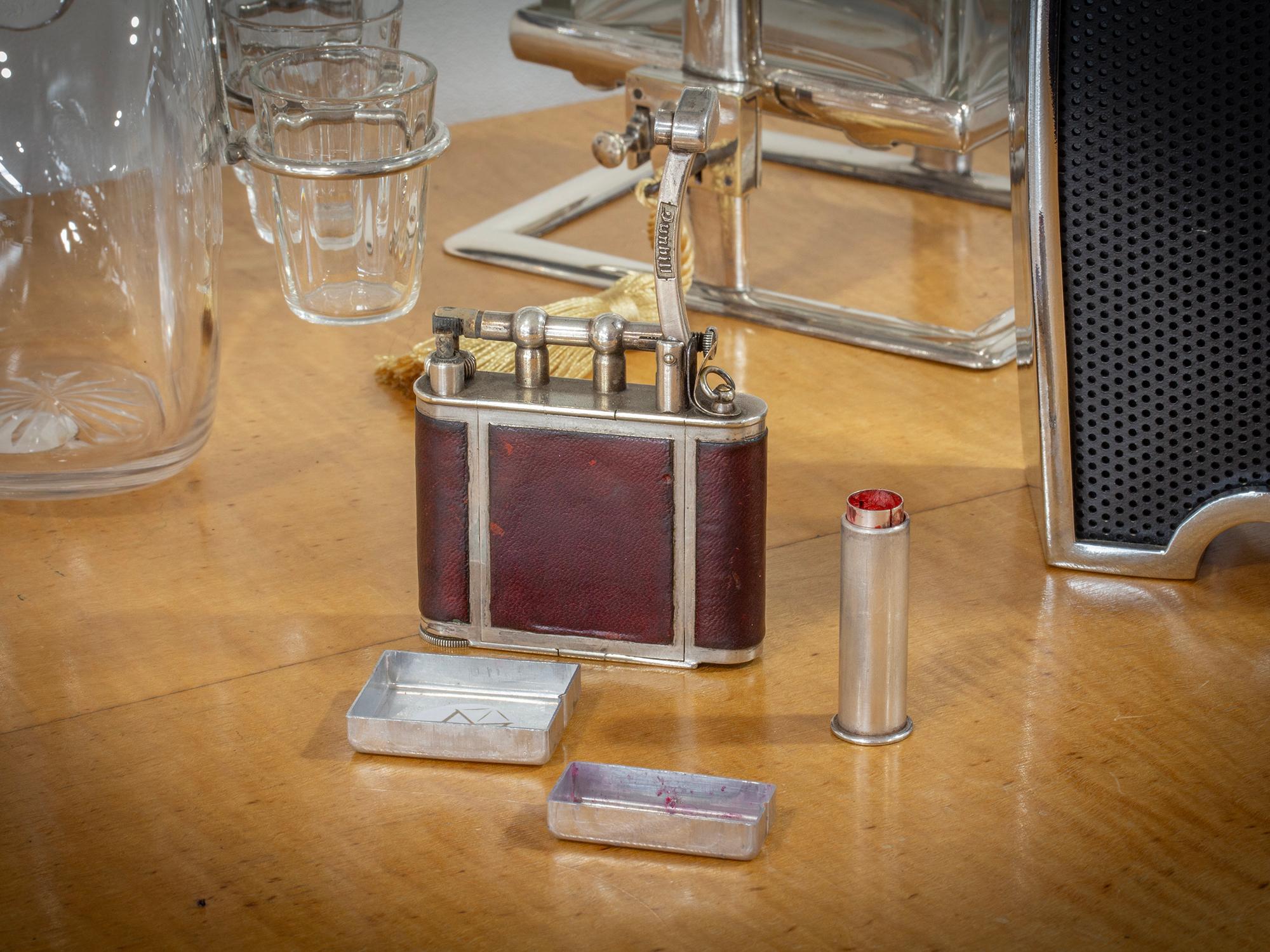 Dunhill Lighter Circa 1930

From our Accessories collection, we are pleased to offer this Dunhill Ladies Pocket Vanity Lighter. The Dunhill Lighter of petit size with leather panels upon a silver plate frame with petrol lift arm stamped Dunhill. The