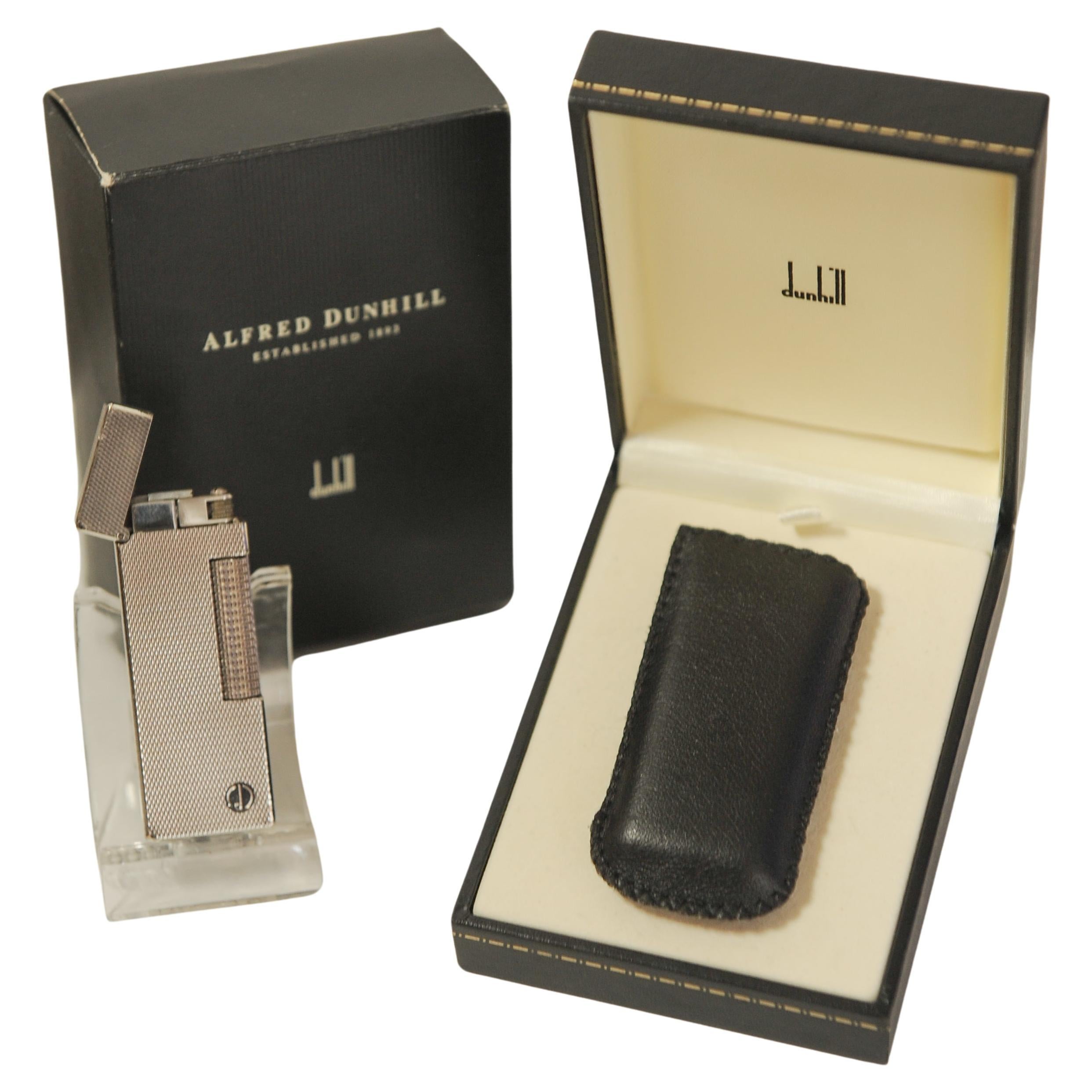 Alfred Dunhill Silver Plated Rollagas Cigarette Lighter With Original Box, and leather soft case


Stamped Dunhill & Swiss Made on Lighter Base


The Rollagas lighter is a dunhill classic, featuring our famous 'snap-shut' lid and a rolling strike