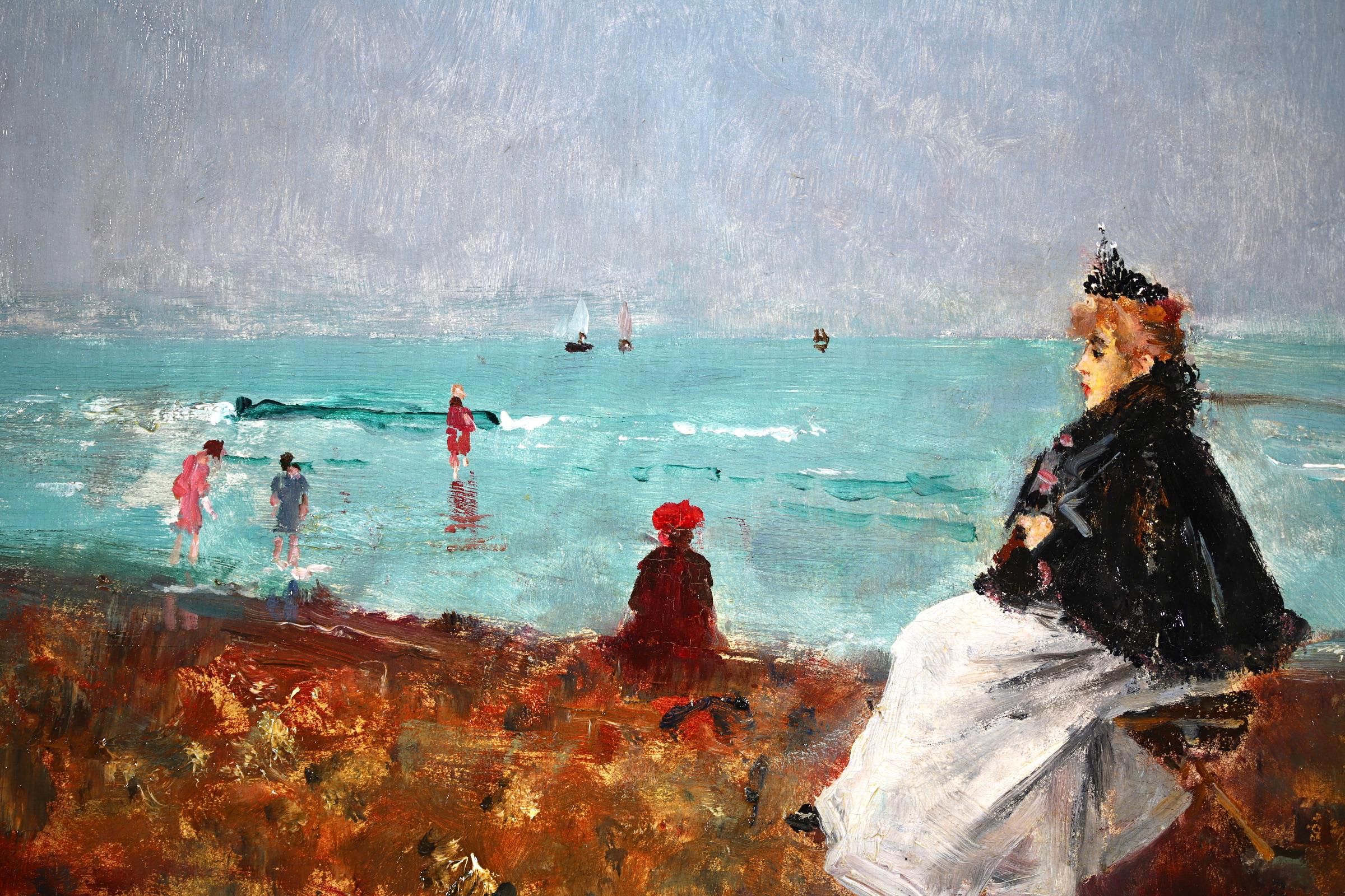 Signé et daté figures dans un paysage marin, huile sur panneau du peintre impressionniste belge Alfred Emile Leopold Stevens. L'œuvre représente une femme élégante assise sur un étal à la plage, tandis que des enfants pagaient dans la mer turquoise.