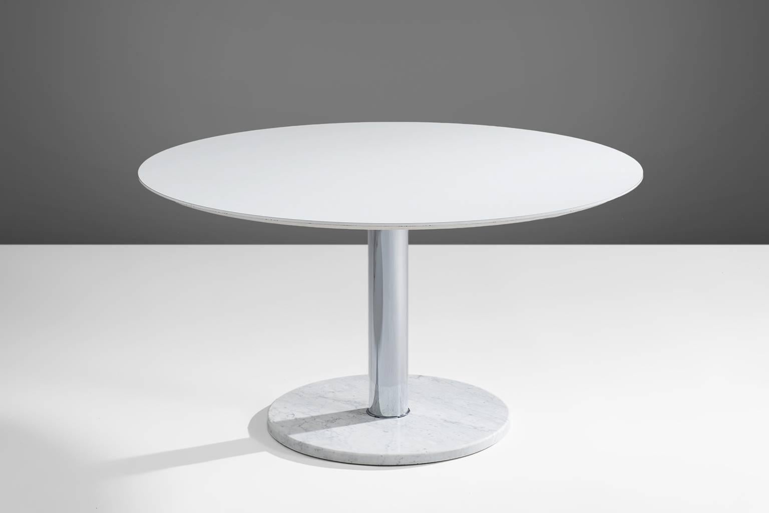 Alfred Hendrickx for Belform, pedestal dining table, Belgium, circa 1960. 

This round formica top placed on a central chrome tube. The base is made of a with marble round plate. Very modern, slick design that bears traits of the International