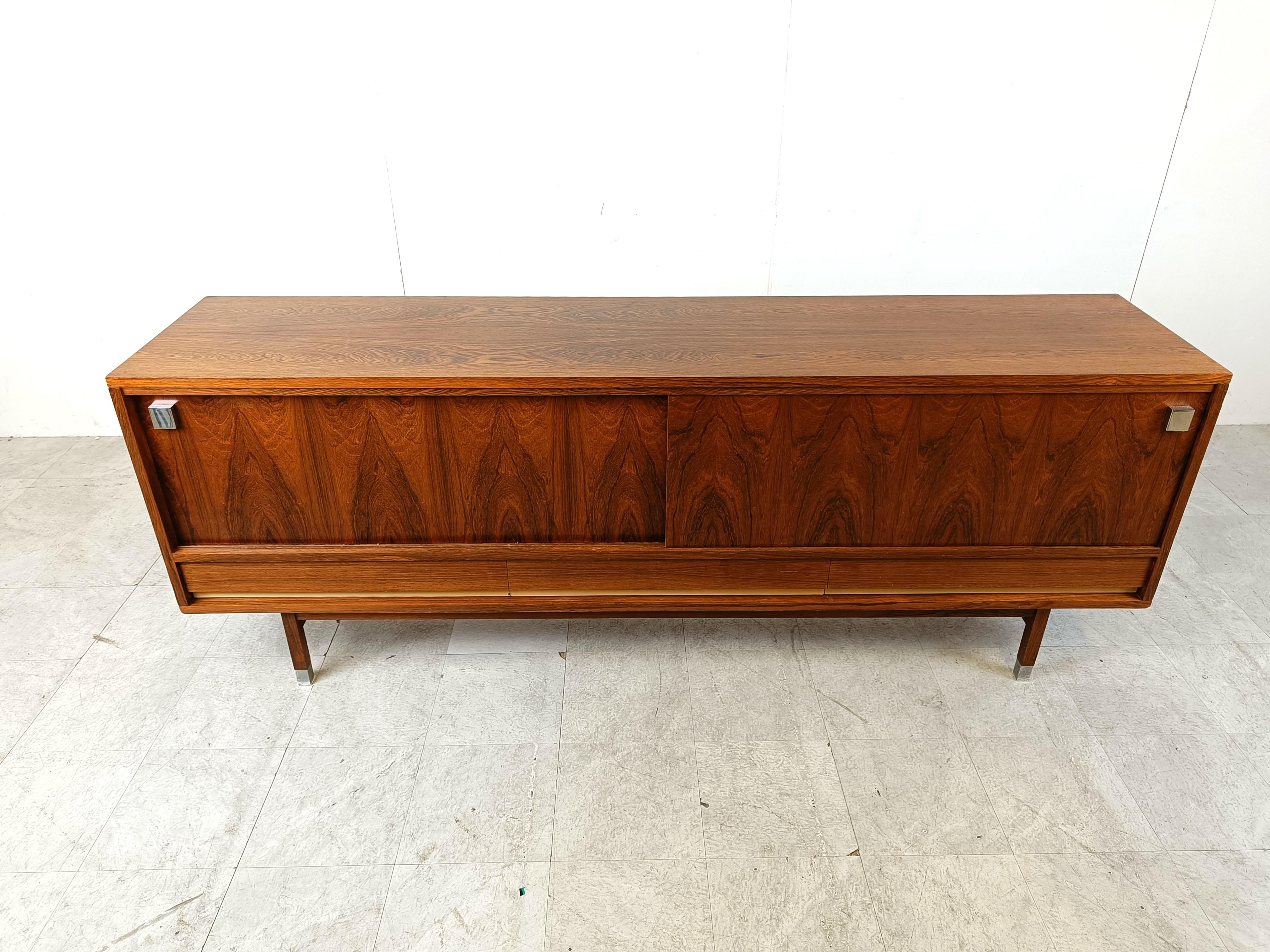 Mid century minimalist sideboard designed by Belgian designer Alfred Hendrickx for Belform in the 1960s.

Very spacious sideboard with sliding doors and 3 drawers.

Good condition.

1960s - Belgium

Dimensions:

Lenght: 220cm/86.61