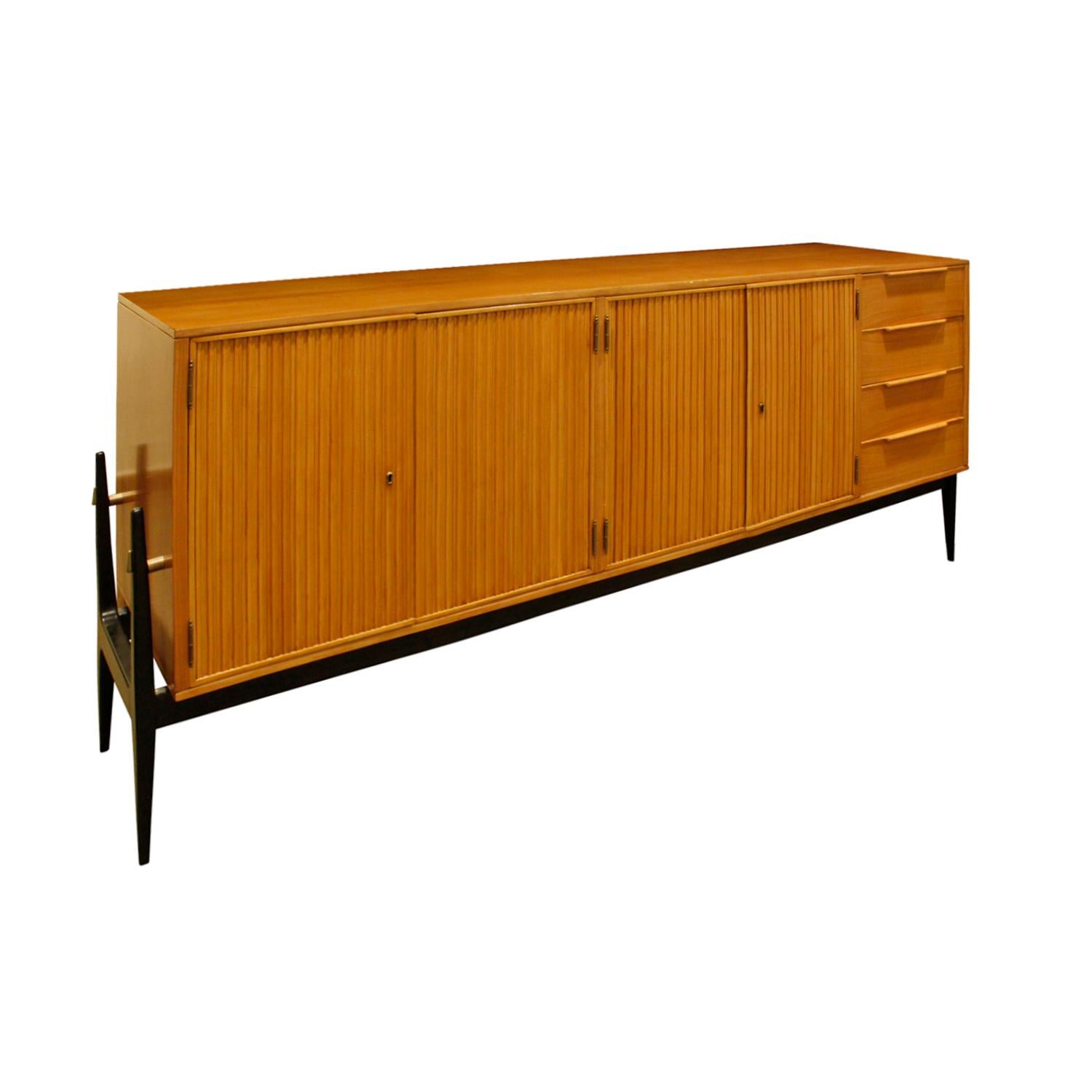 Credenza with 4 fluted doors and 4 drawers on the right in fruitwood on an ebonized base in the style of Alfred Hendrickx, Belgium, 1950s. This piece is beautifully crafted and very elegant.