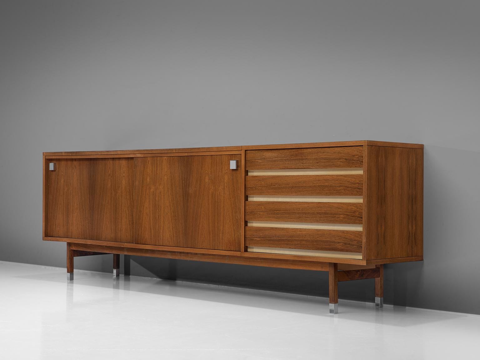 Alfred Hendrickx for Belform, sideboard in rosewood, Belgium, 1960s. 

Large sideboard in rosewood designed by Alfred Hendrickx. This credenza consist of two sliding doors with characteristic black square metal handles. The design of this model is