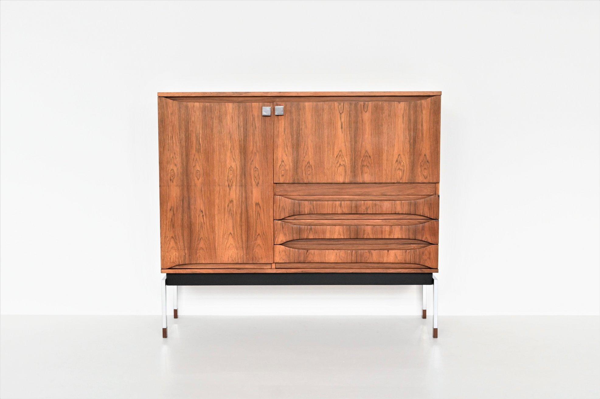 Beautiful high bar cabinet or buffet designed by Alfred Hendrickx and manufactured by Belform, Belgium 1960. This nicely refined cabinet is made of veneered rosewood supported by a brushed steel frame with wooden tips. It has an amazing flamed grain
