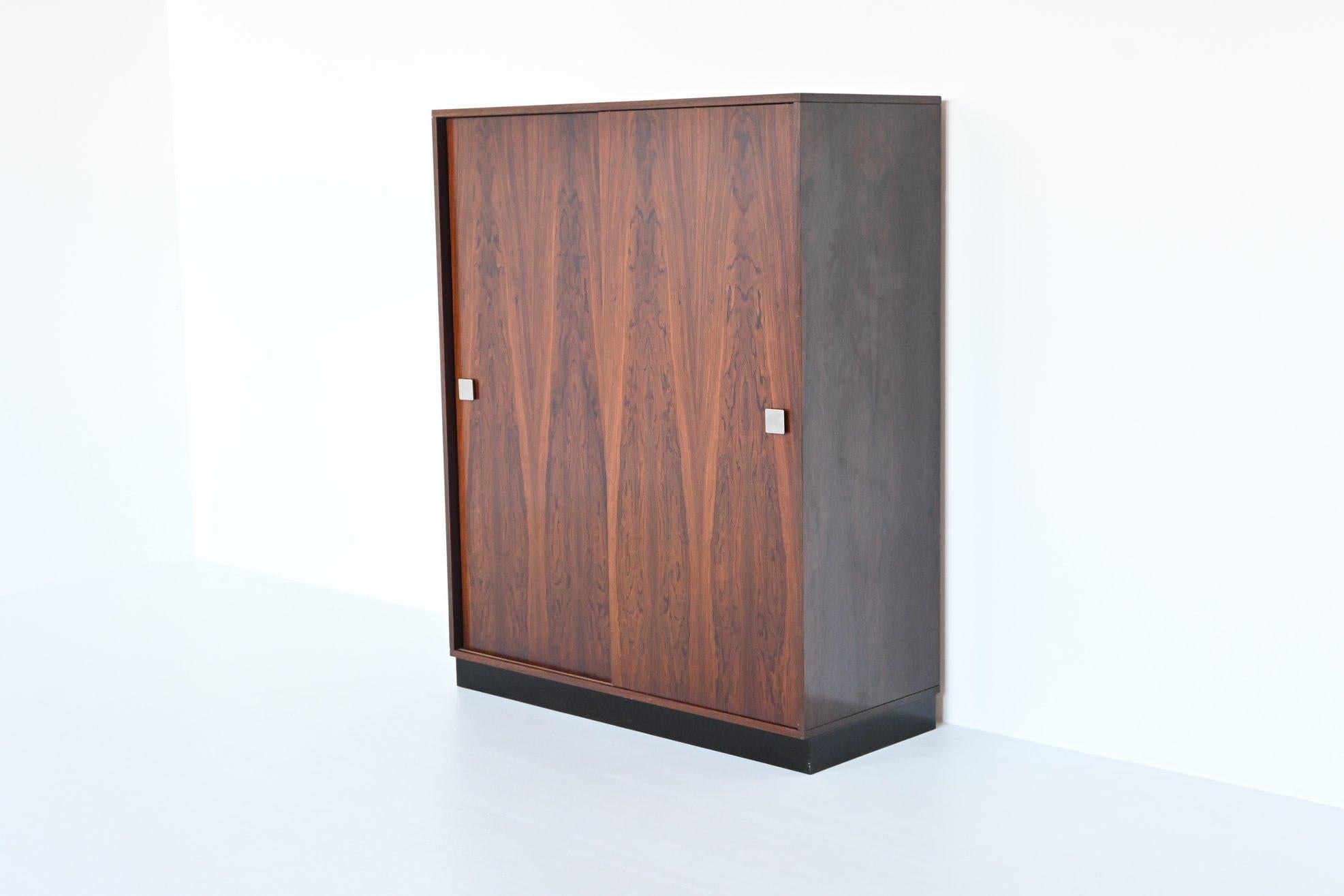 Beautiful wardrobe designed by Alfred Hendrickx and manufactured by Belform, Belgium 1960. This very nice cabinet is made of beautiful grained rosewood with a black lacquered base. It is a very nicely crafted piece of Belgium mid-century furniture.