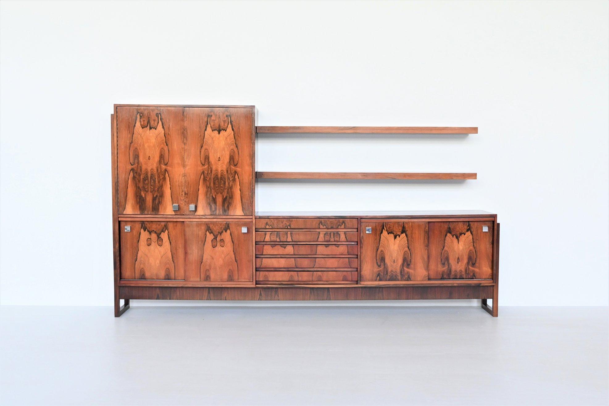 Amazing and unique large sideboard in the style of Alfred Hendrickx for Belform, Belgium 1960. This cabinet is made of veneered rosewood supported by a beautiful shaped solid rosewood frame. Typical Belform are the chromed metal square shaped