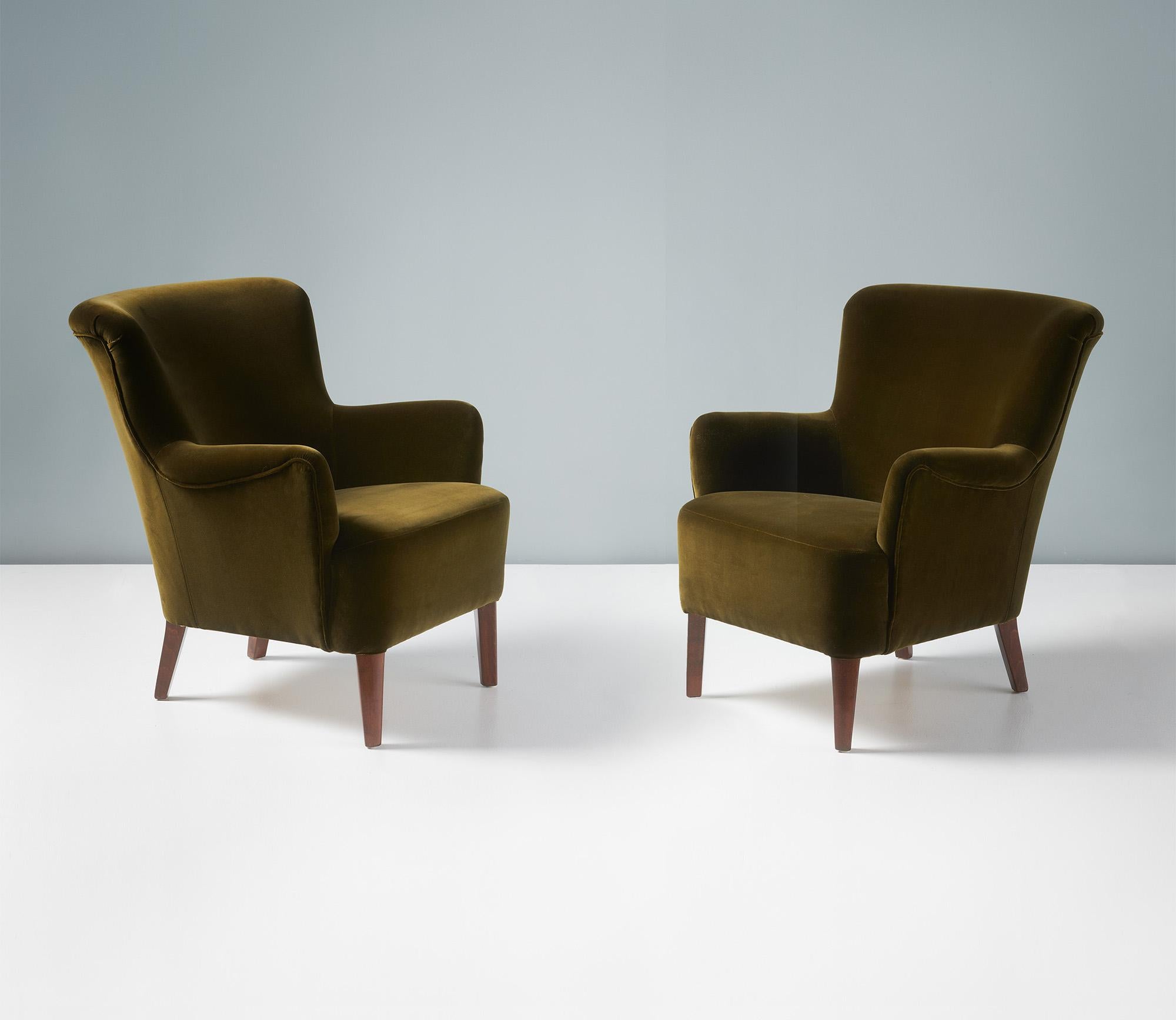 Alfred Kristensen - Pair of Lounge Chairs, circa 1950s.

These elegant lounge chairs were produced by renowned cabinetmakers Slagelse Mobelvaerk in Denmark in the early 1950s and designed by the company's owner: Alfred Kristensen. The beech legs