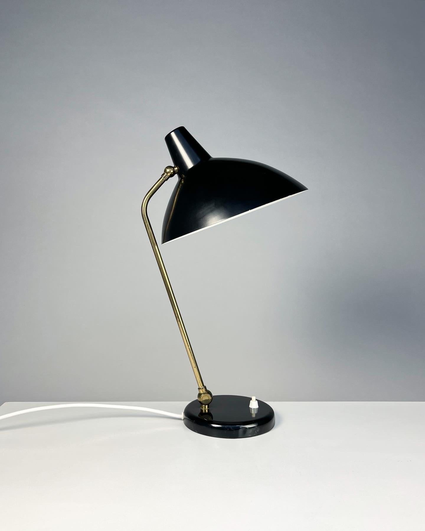 Desk lamp designed by Alfred Müller in the 1940s, model ‚Adria’ for AMBA (Alfred Müller BAsel), manufactured in Basel, Switzerland in the 1950s. 

Known for its sophisticated joints this lamp can be adjusted in various positions, both joints can