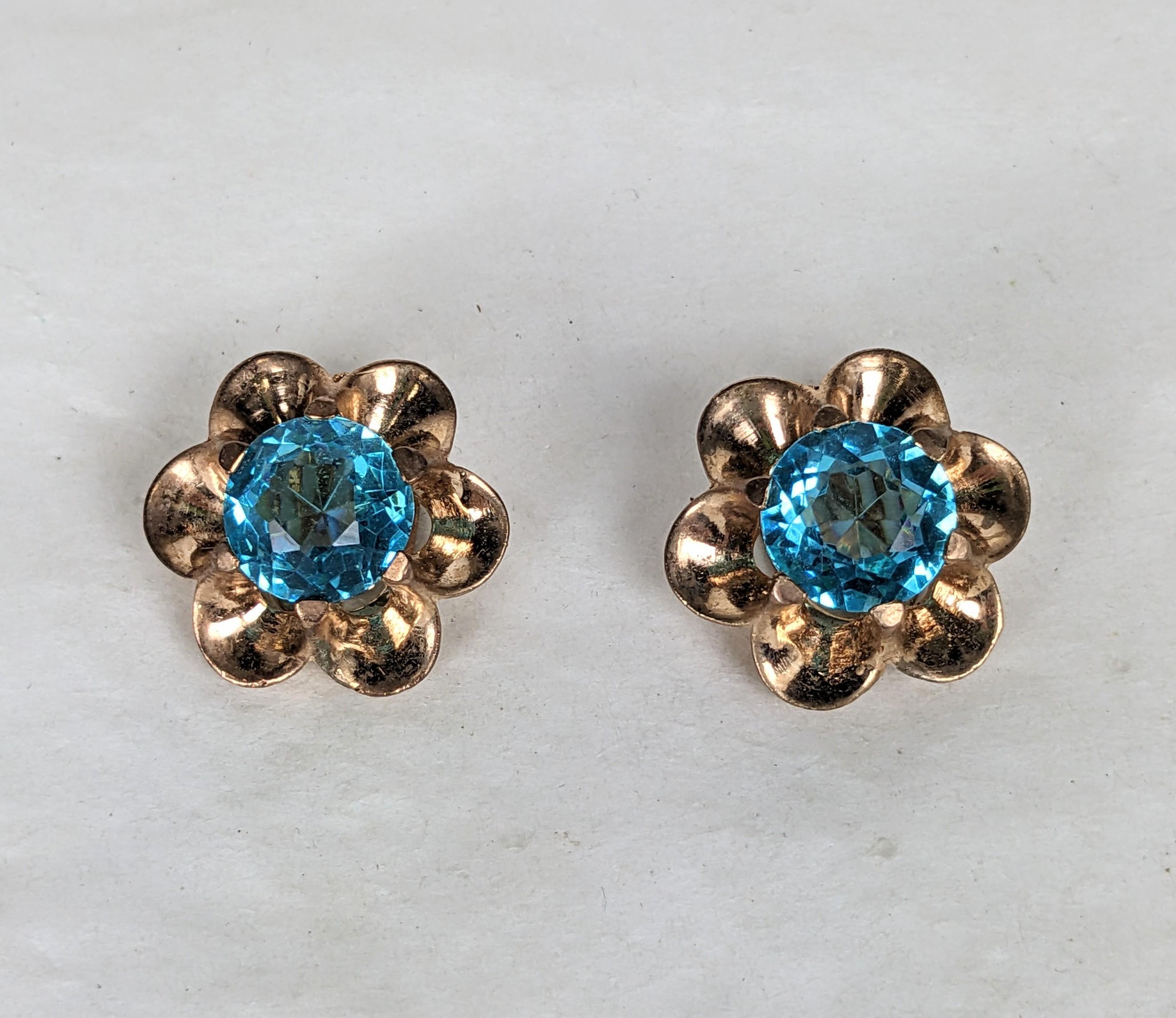 Alfred Philippe for Trifari aquamarine Retro earclips.  Of gold plate based metal, the glass aquamarine faceted stones set into a round retro scalloped shell setting. Excellent Condition.
Clip back fitting. L .75 