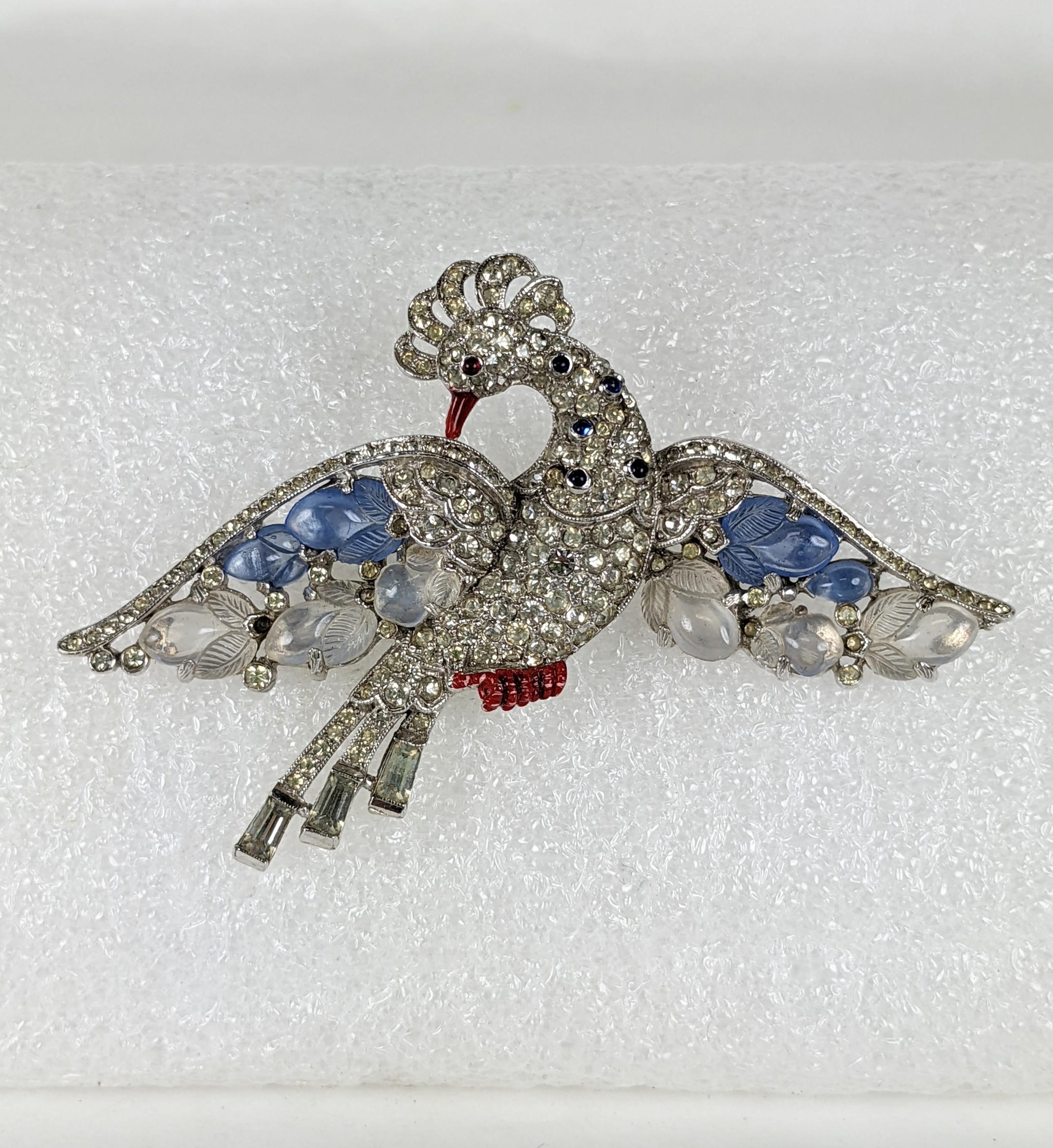Alfred Philippe for Trifari pave and blue and white opal fruit salad rising peacock in flight. Of rhodium plated base metal, crystal rhinestone pave and key stone baguettes, small ruby and sapphire cabochons, molded  glass fruit salad with cold