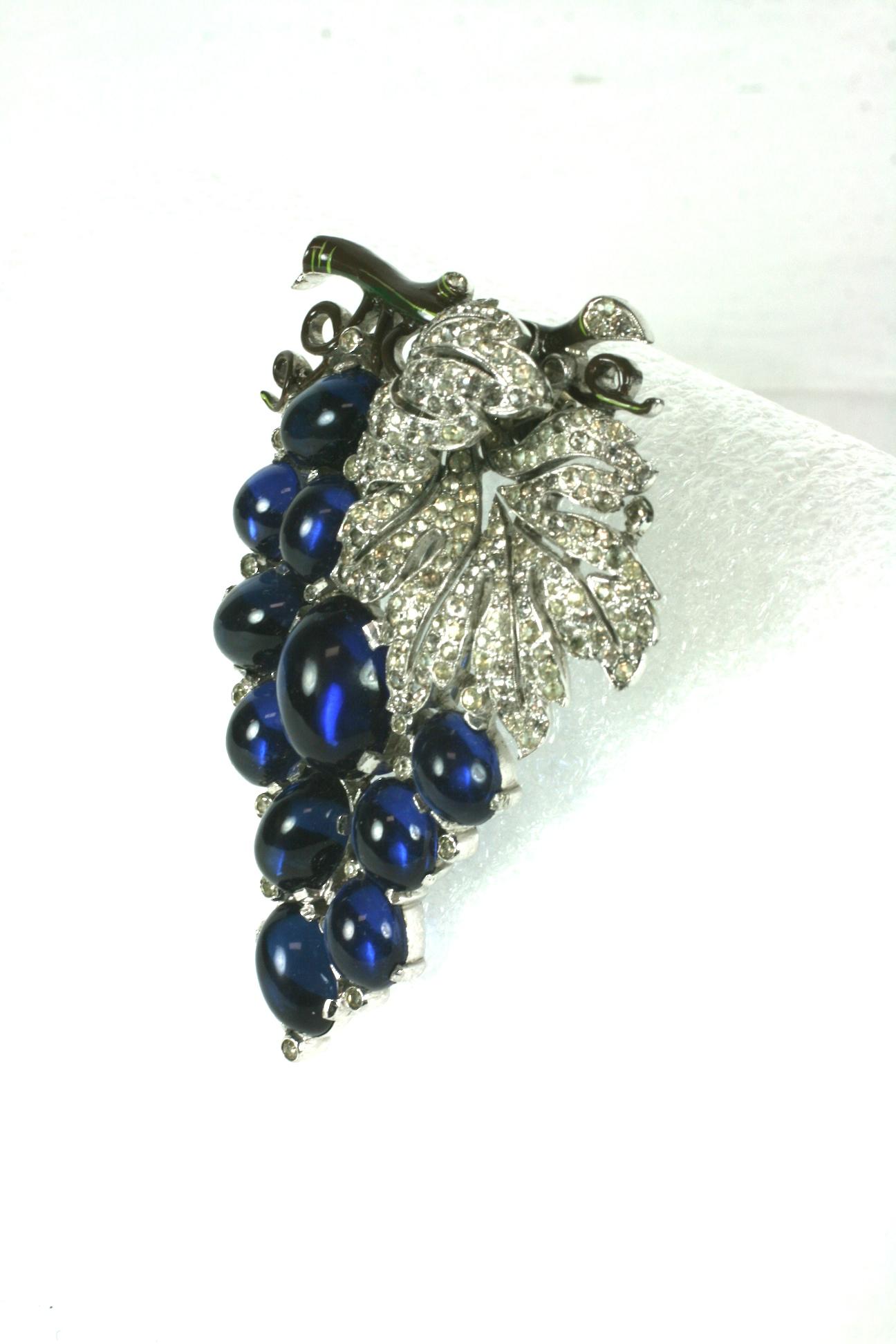 Exceptional  and rare Alfred Philippe for Trifari grape cluster fur clip brooch of faux sapphire cabochons with crystal rhinestone pave. Large in scale with finely detailed cold enameling on the branch and vines. Set in rhodium plate base