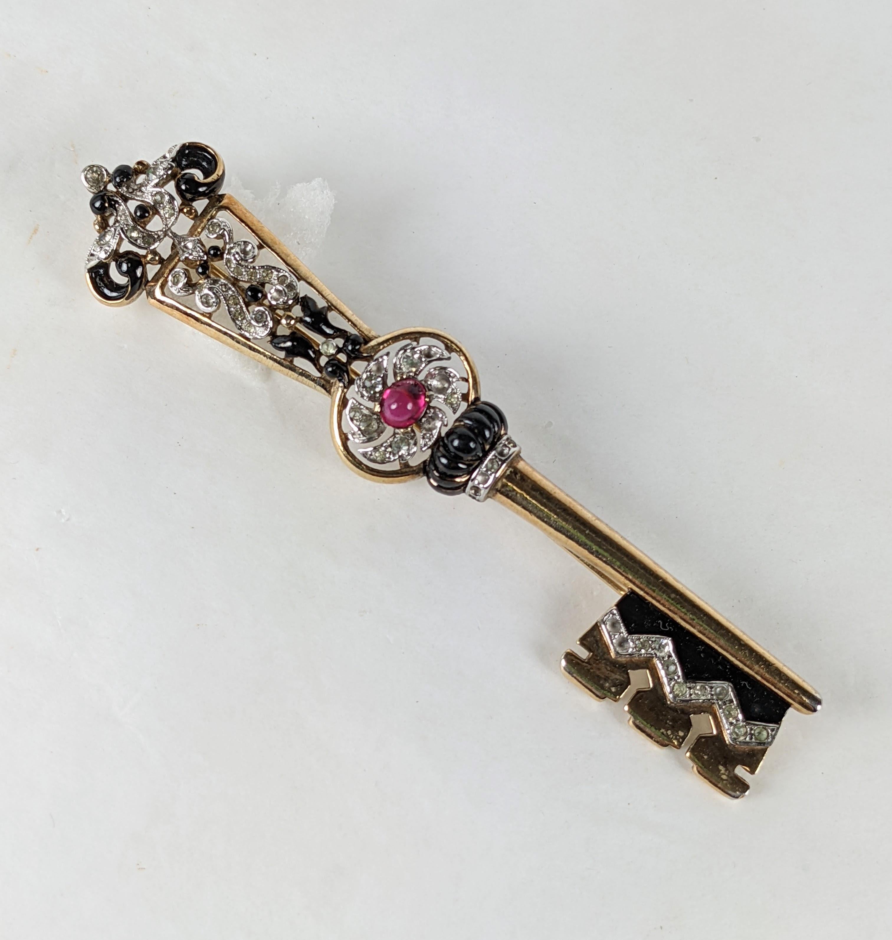 Rare Alfred Phillipe for Trifari large key brooch of rose  gold plated base metal, crystal rhinestone pave, cold  black enamel and a focal faux ruby cabochon. Very Good Condition. Marked: Trifari with Crown, Pat Pend. Length 4 1/8 