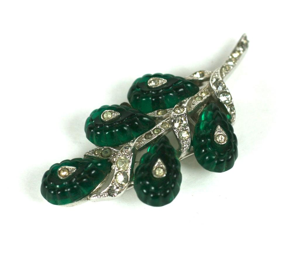 Alfred Phillippe for Trifari  Art Deco faux emerald jelly molded teardrop shaped Fruit Salad cabochon fur clip brooch. Of rhodium plate base metal and crystal rhinestone pave. 
Excellent Condition, Signed Trifari.
Length 2.5