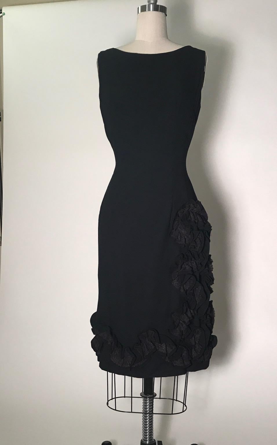 Alfred Werber of Saint Louis 1960's vintage little black dress. Sleeveless, tailored shape. Ruffle detail  with lace accent runs up side and around hem. Back metal zip and hook.

No content tag, feels like silk crepe. 

No size tag, best fits a size