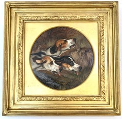 19th century English portrait of three fox Hounds head studies in a landscape.