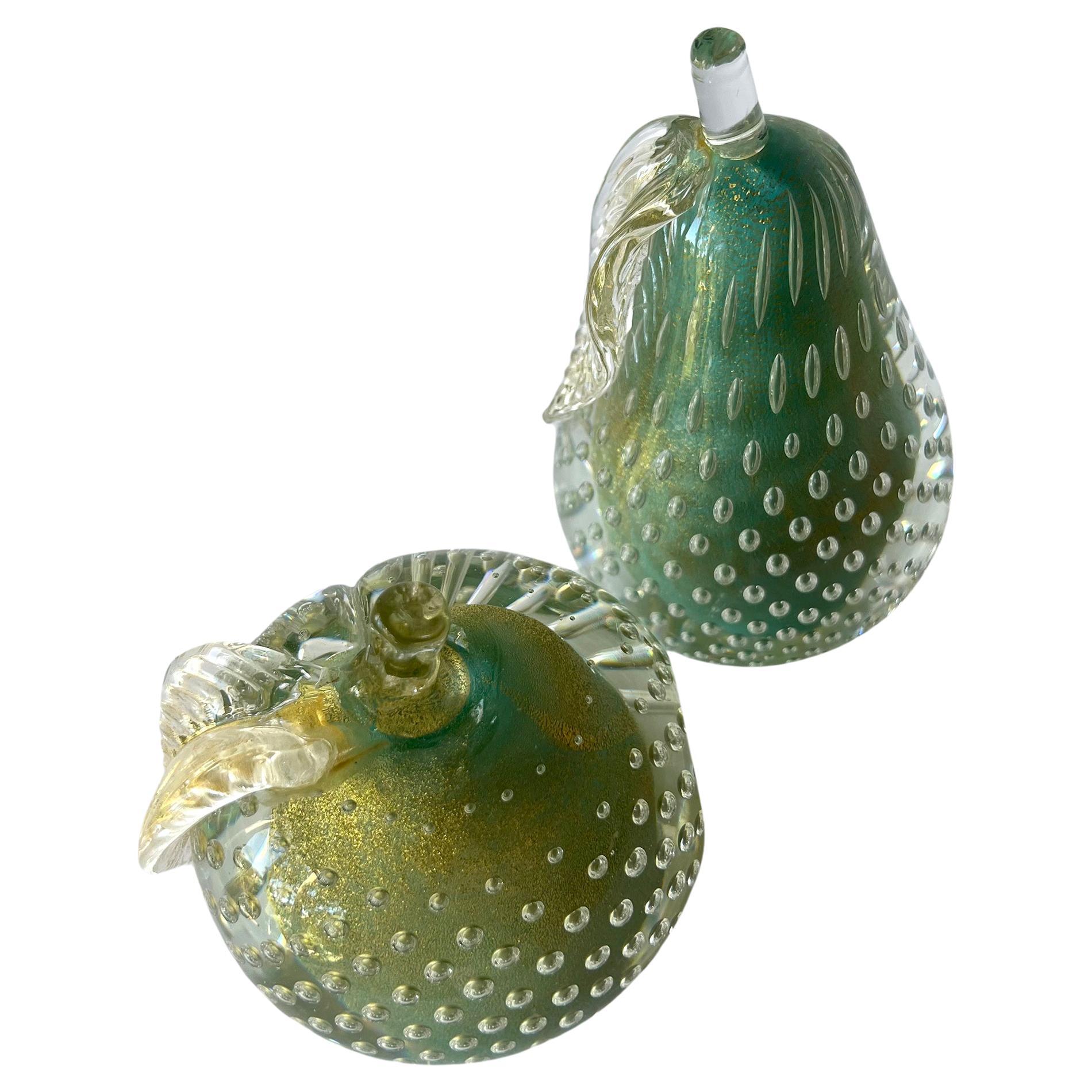 Teal Alfredo Barbini glass fruit paperweights or bookends with layers of golden aventurine within.  Made in Murano, Italy circa 1950's.  Pear measures 5