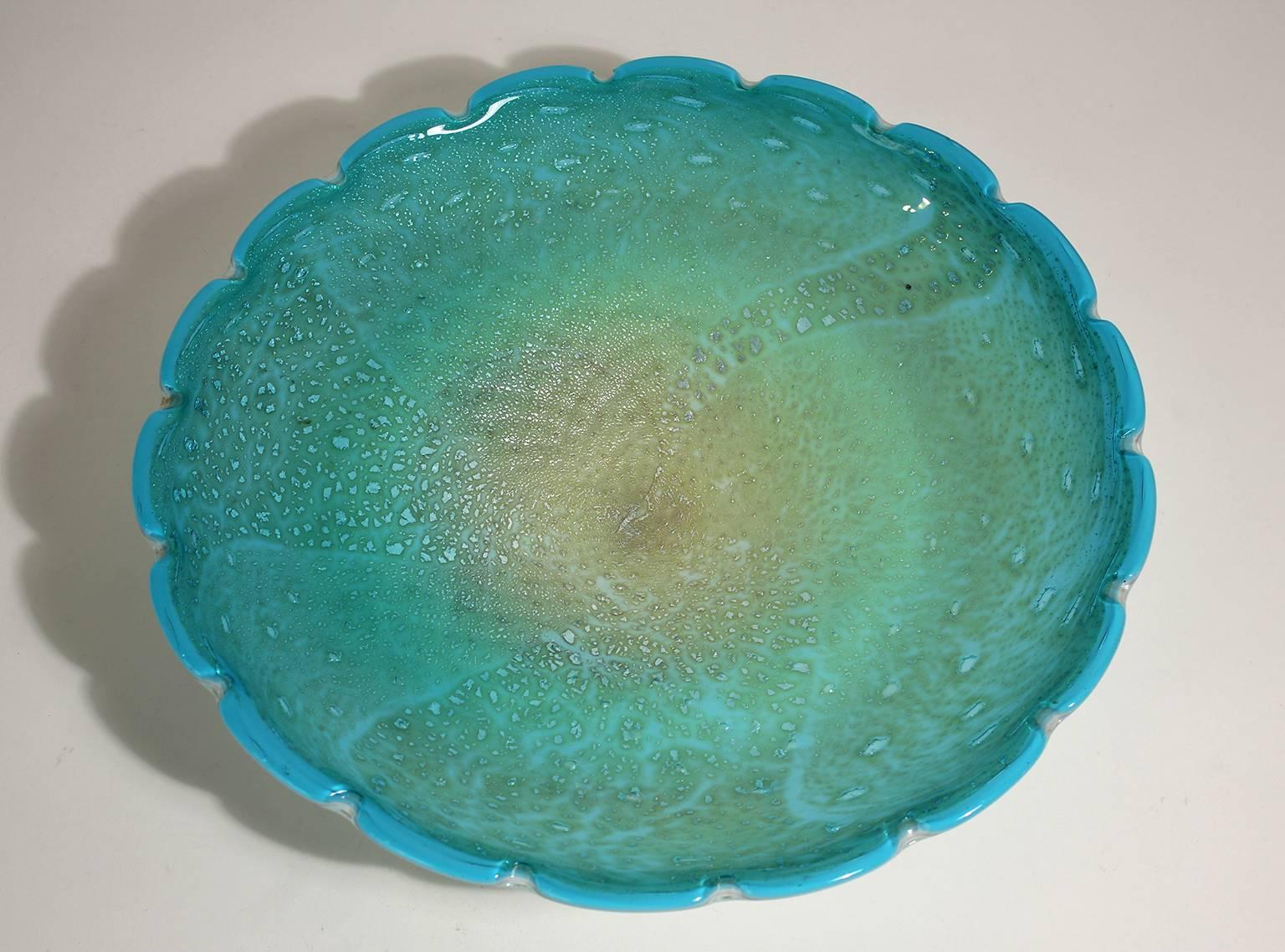 Beautiful scallop edge sky blue and gold speck art glass centerpiece dish bowl made by Alfredo Barbini for Murano glass, circa 1950s.Has the remains of the original foil label on the bottom. Made in Italy. In excellent condition. Measures: 13 1/4