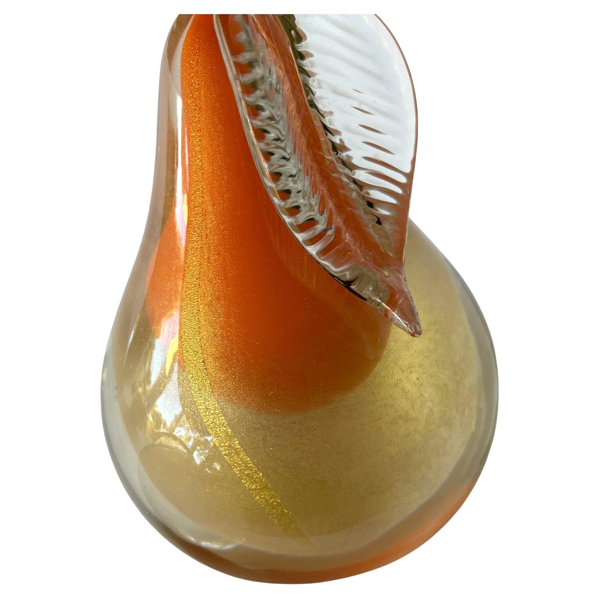 Alfredo Barbini glass fruit paperweights or bookends with layers of golden aventurine within.  Made in Murano, Italy circa 1950's.  Pear measures 6.5