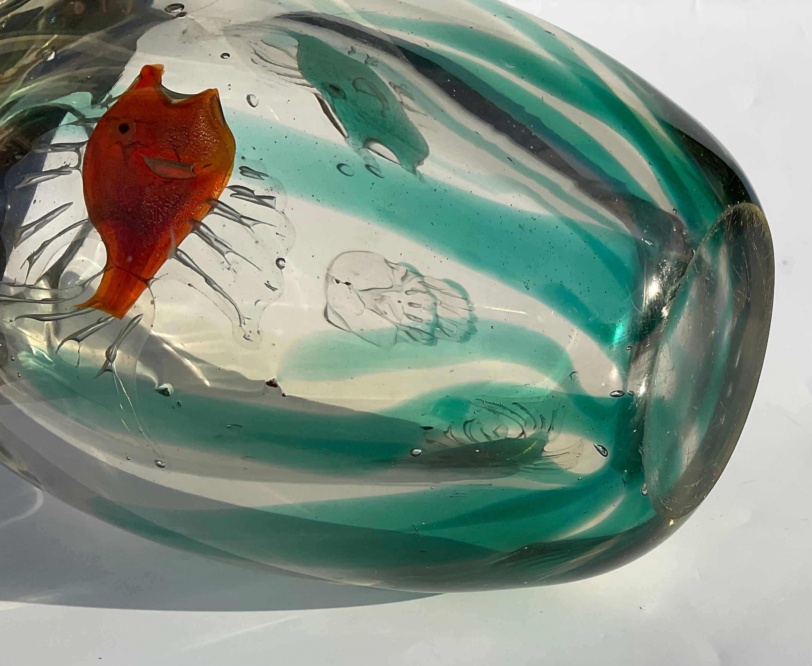 Offered for sale is a rare and important Alfredo Barbini (1912-2007) Italian Murano blown glass aquarium vase. This fine example of Barbini's work has wonderful detail to the fish, fabulous transparency and a great colors. This heavy and substantial