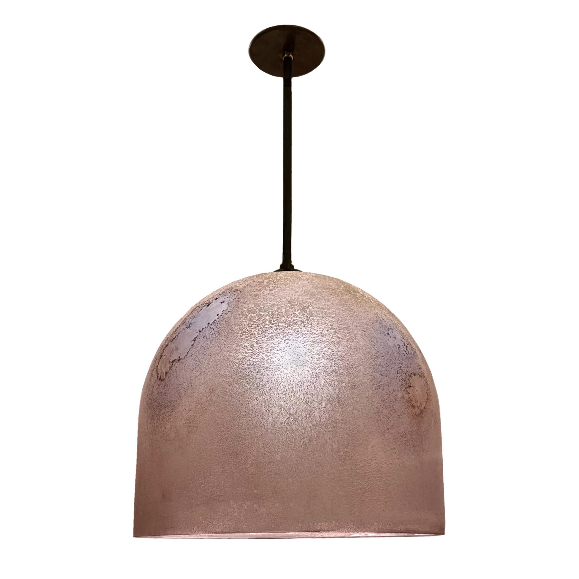 With it's simple form and unique appearance, characterized by its all over scavo effect, the Medusa pendant is one of the many highly sought after creations of master glassmaker Alfredo Barbini.

Renowned for his innovation, and considered one of