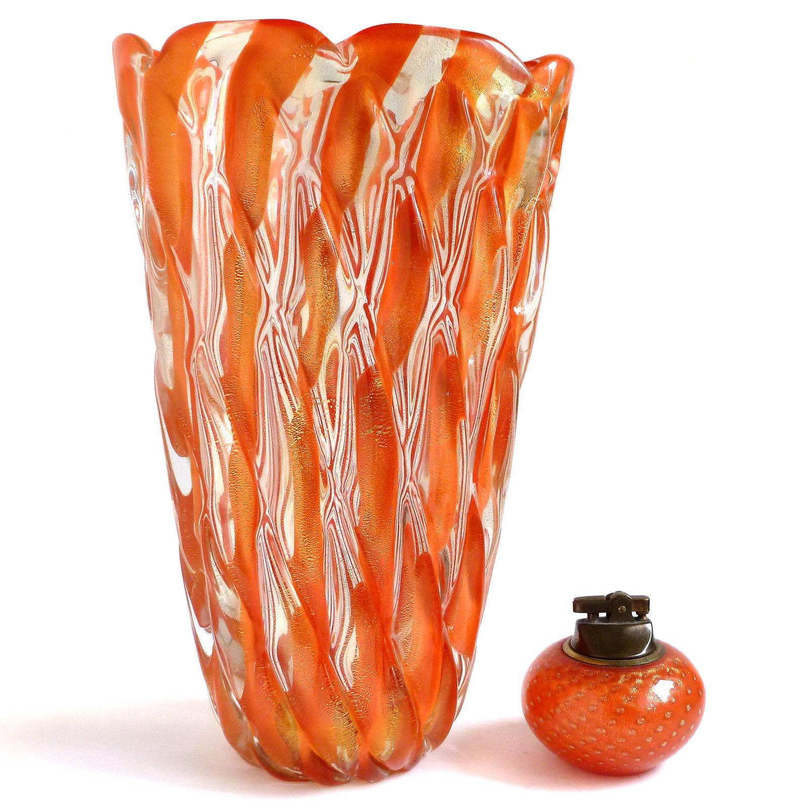 Gorgeous large Murano handblown orange stripes and gold flecks Italian art glass pillow quilted surface flower vase. Documented to designer Alfredo Barbini, circa 1950s (published in his catalogue). An impressive and rare piece. Mid century era.