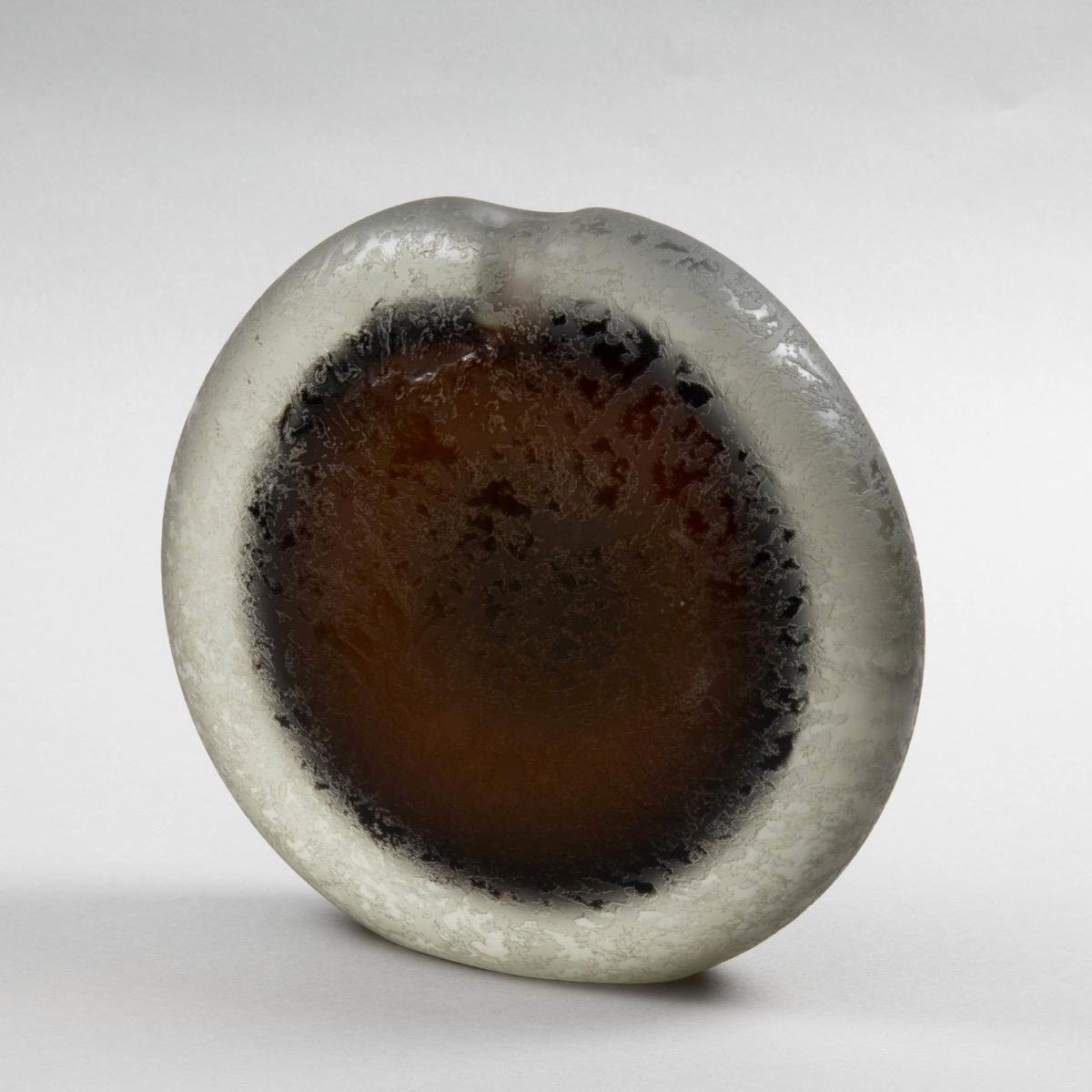 Sculpture vase, mouth glass blown, brown glass incased in thick clear glass, hole pierced to top, entire body corroded by acid bath.

About Alfredo Barbini:

Alfredo, a Murano glass artist was born in 1912 on the island of Murano.
He is