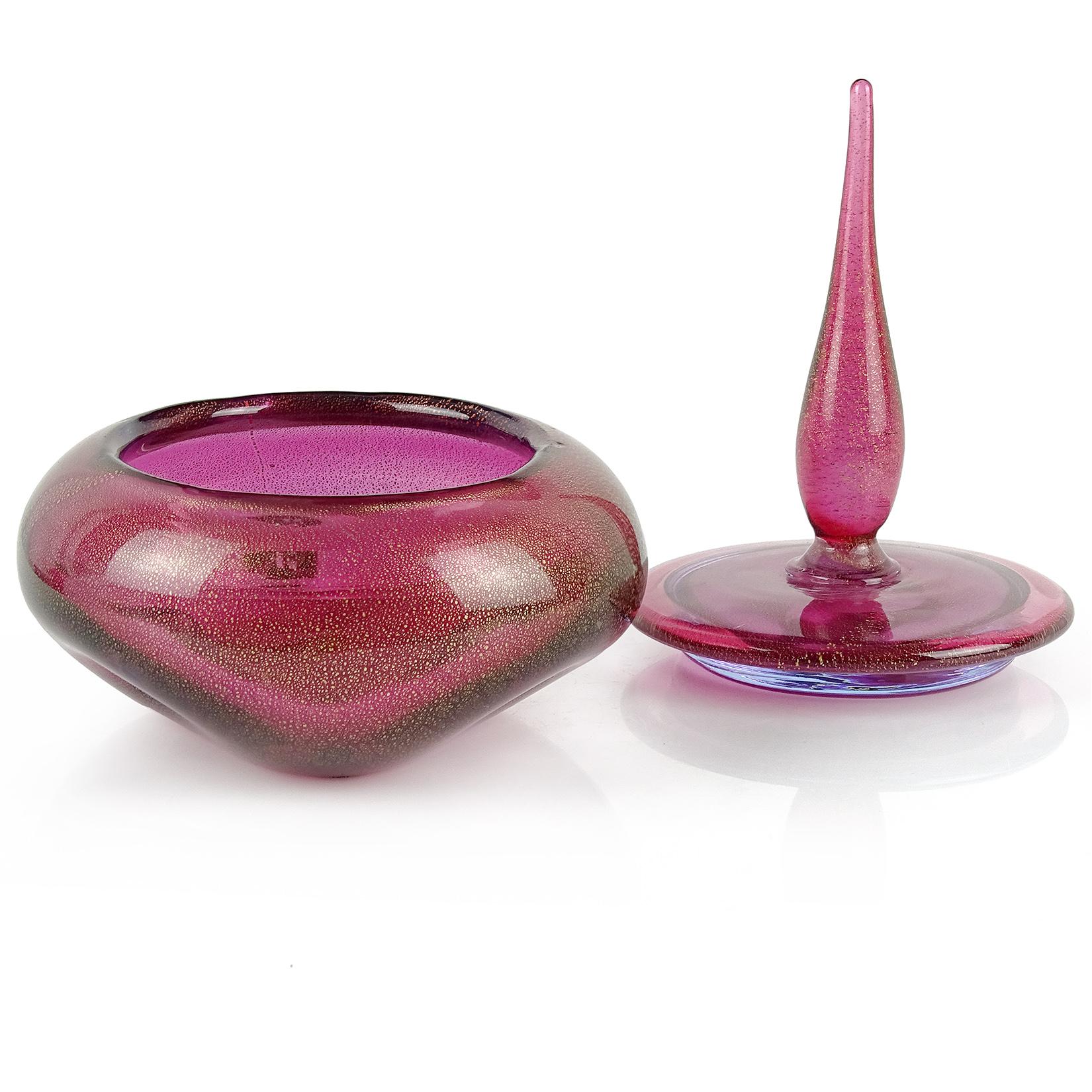 Beautiful Murano handblown amethyst and gold flecks Italian art glass powder / jewelry box. Documented to designer Alfredo Barbini, circa 1950s. The piece has three dimples on the body, with a spike top decoration. Also has a hint of blue, specially