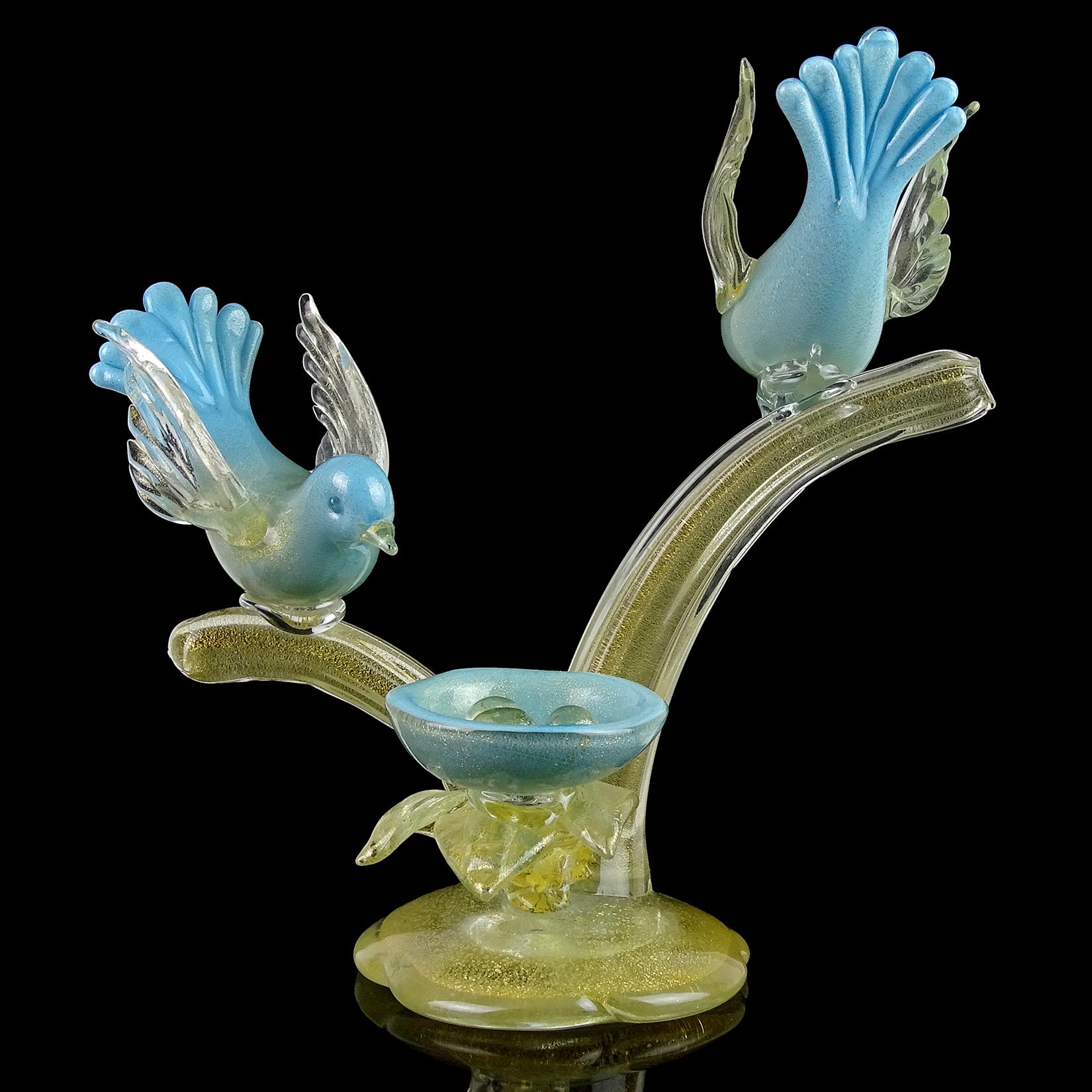 Beautiful large vintage Murano hand blown blue and gold flecks Italian art glass birds on tree branch sculpture, looking over nest with eggs. Documented to designer Alfredo Barbini. The birds are beautifully sculpted and profusely filled with gold