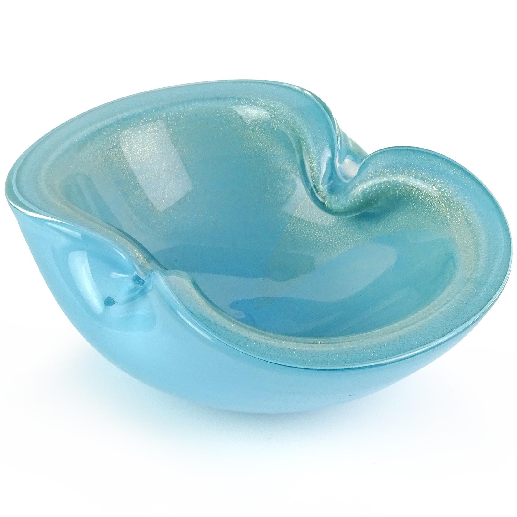 Beautiful Murano hand blown blue and gold flecks Italian art glass bowl / dish. Documented to designer Alfredo Barbini. Has heavy gold leaf on the inside of the bowl, with two indents on the rim. Measures: 7 1/4” long.