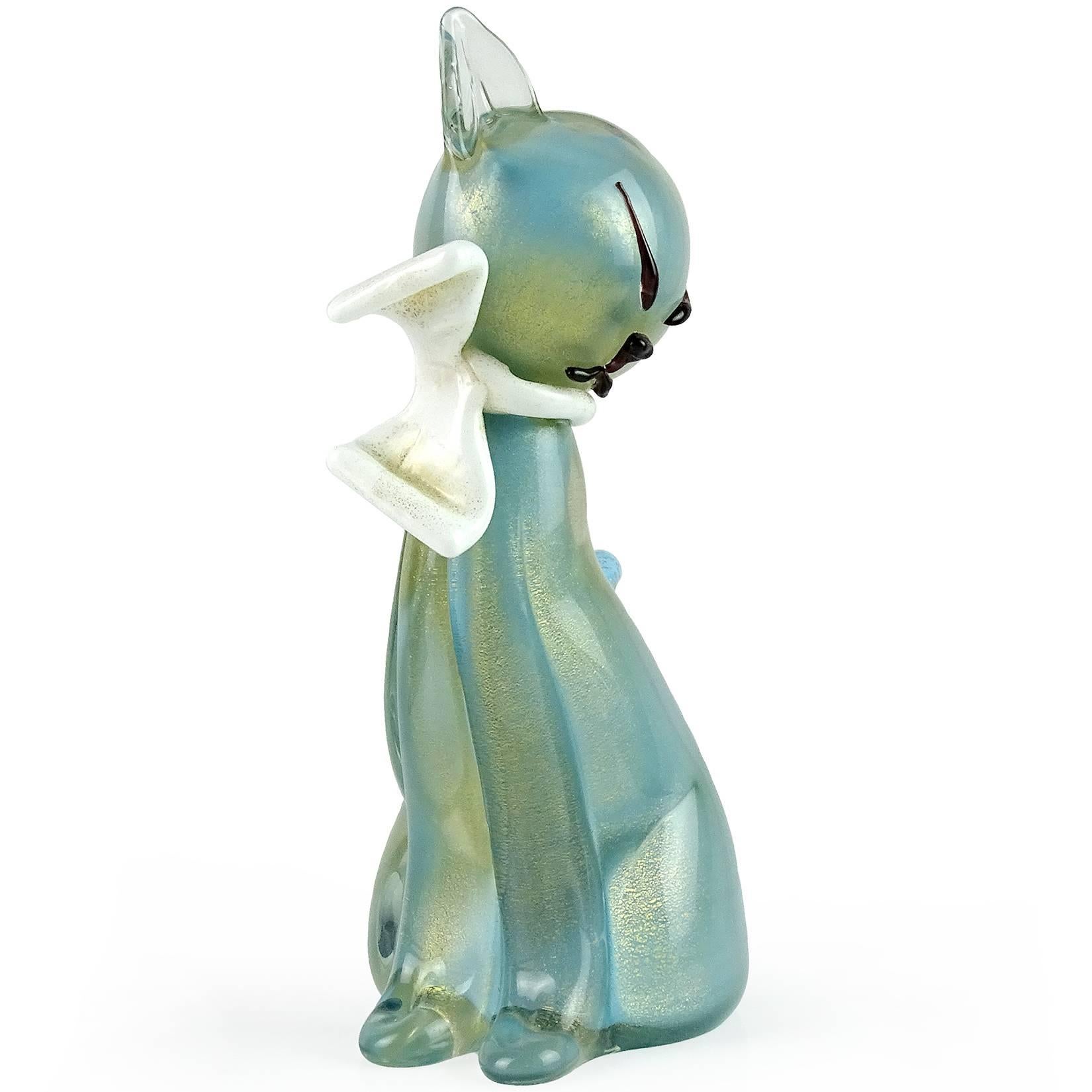 Gorgeous Murano handblown blue and gold flecks Italian art glass cat figurine or sculpture with white bow. Documented to designer Alfredo Barbini, circa 1950s. It is published in his catalog. The kitten has a very elegant shape, with black accents