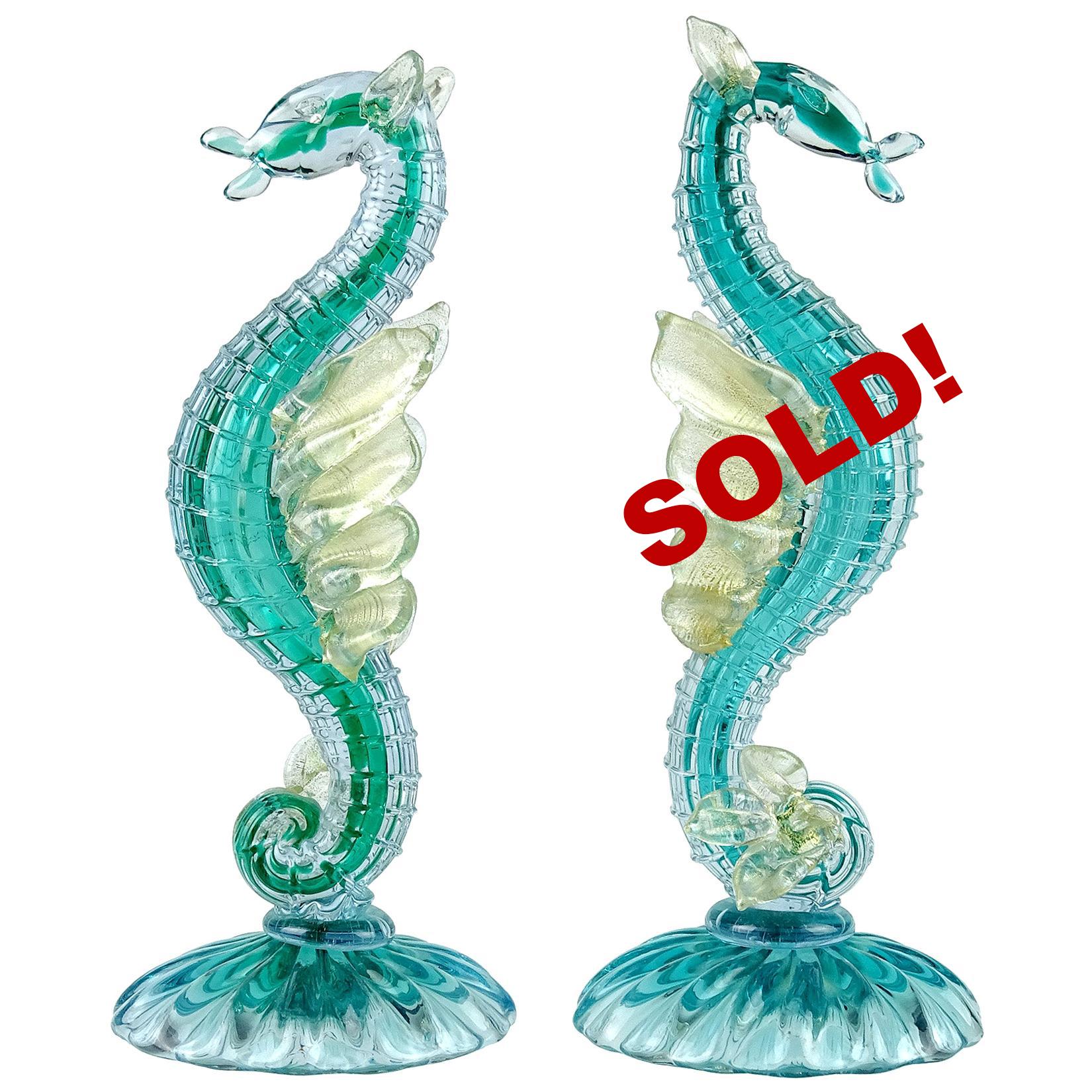 Only 1 Left! Gorgeous vintage Murano hand blown aqua blue/green Sommerso and gold flecks art glass sea horse / winged hippocampus sculpture. Documented to designer Alfredo Barbini, circa 1950s. The figure has applied gold leaf on their ears, eyes,