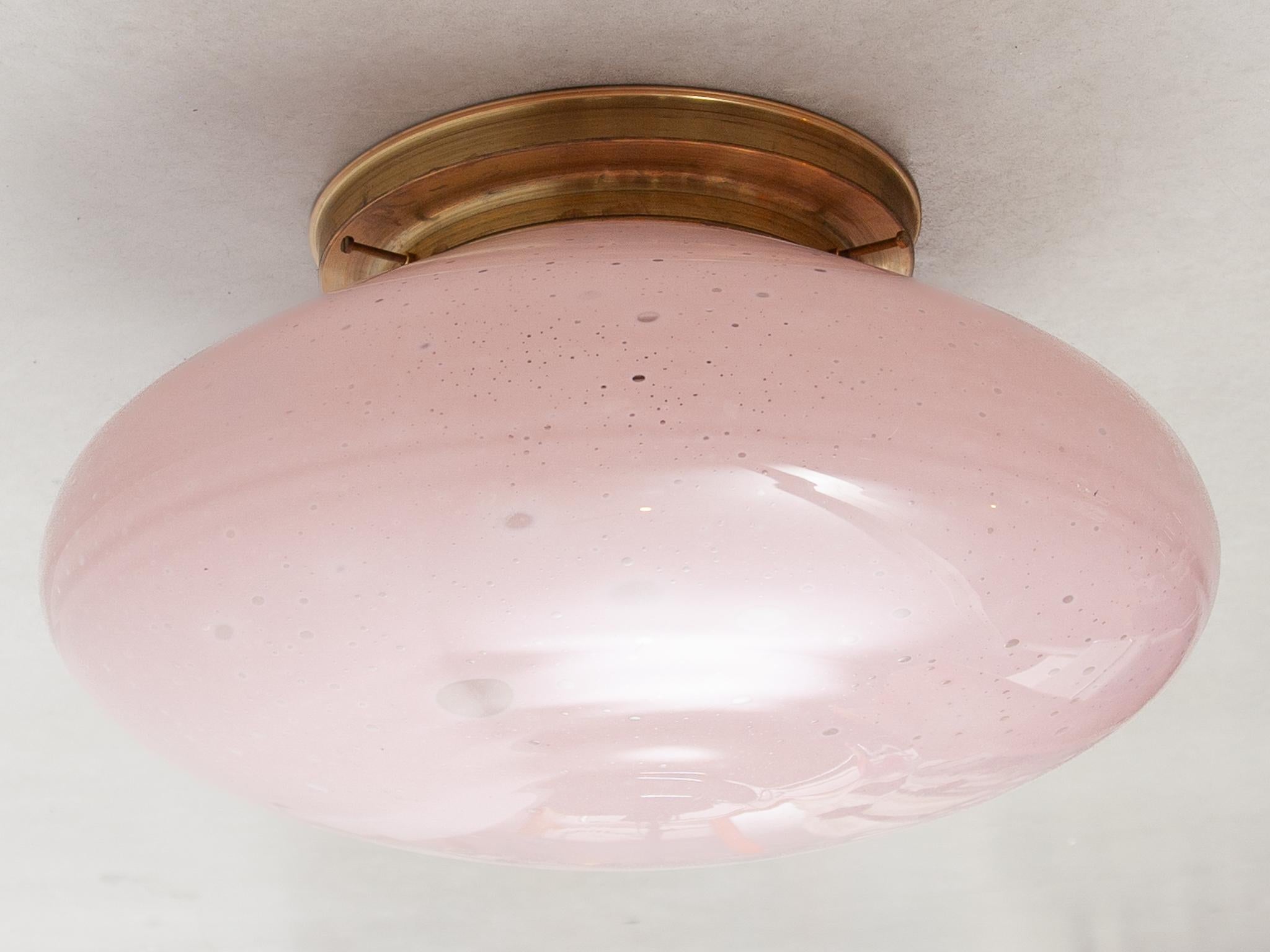 This stunning modernist pink opal glass flush mount, ceiling light was mouth blown in Murano,  1970s designed by Alfredo Barbini, in original very good condition.