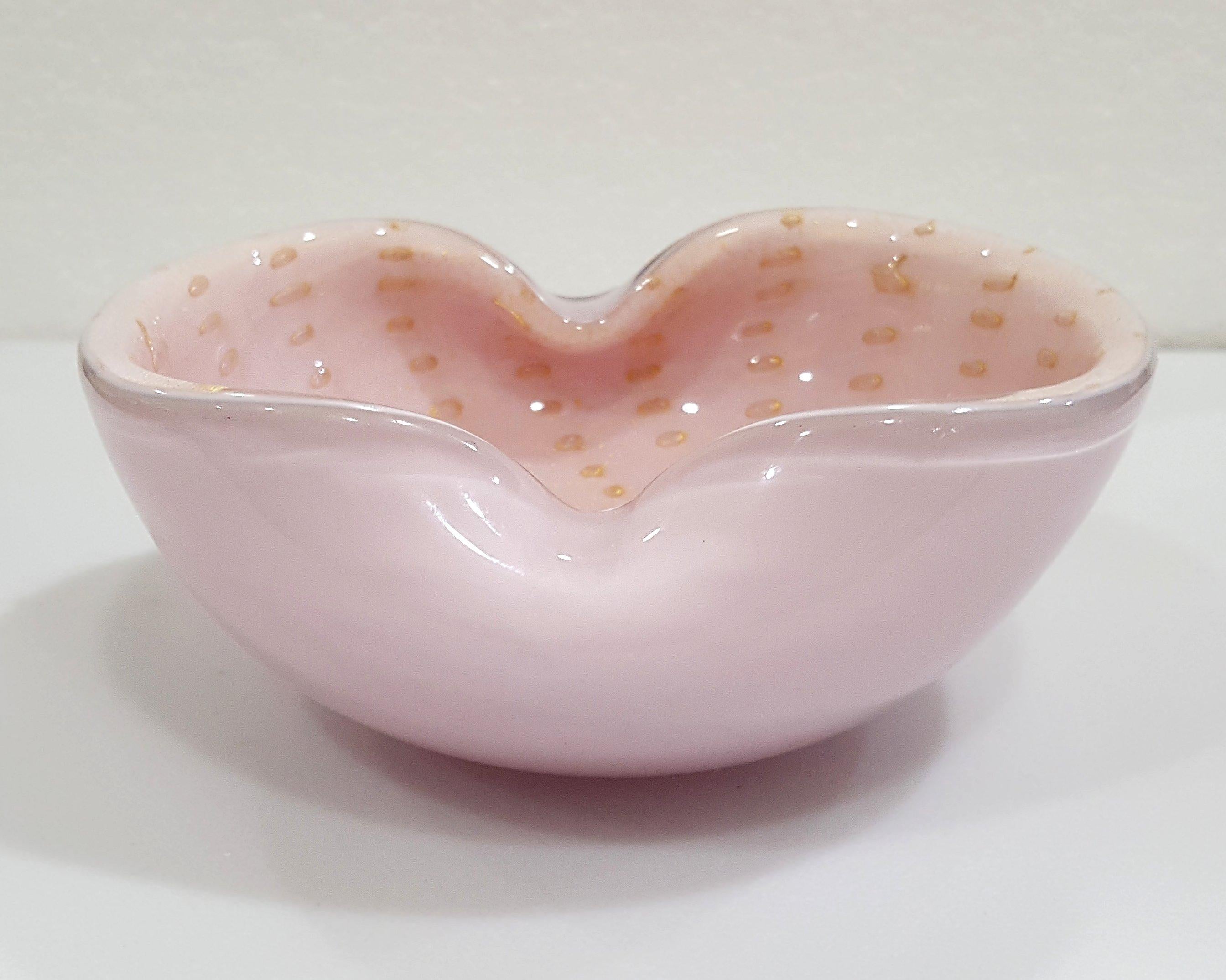 Alfredo Barbini/Murano Glass Bowl w/ Bullicante & Gold Polveri
Light pink with gold. Nice vintage condition. We found no chips and no cracks. 
Measurements are approximate and may vary throughout the piece. Please be aware that the color on your