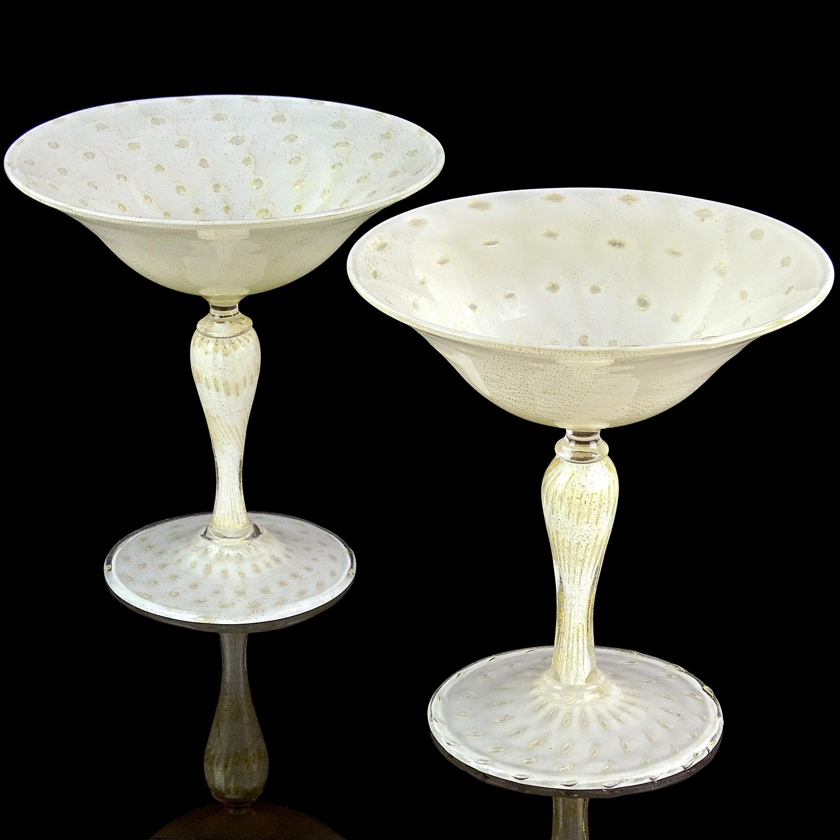Priced per item (2 available as shown). Beautiful vintage Murano hand blown white, controlled bubbles and gold flecks Italian art glass pedestal compote bowl. Documented to designer Alfredo Barbini for Salviati, circa 1950s. Profusely covered in