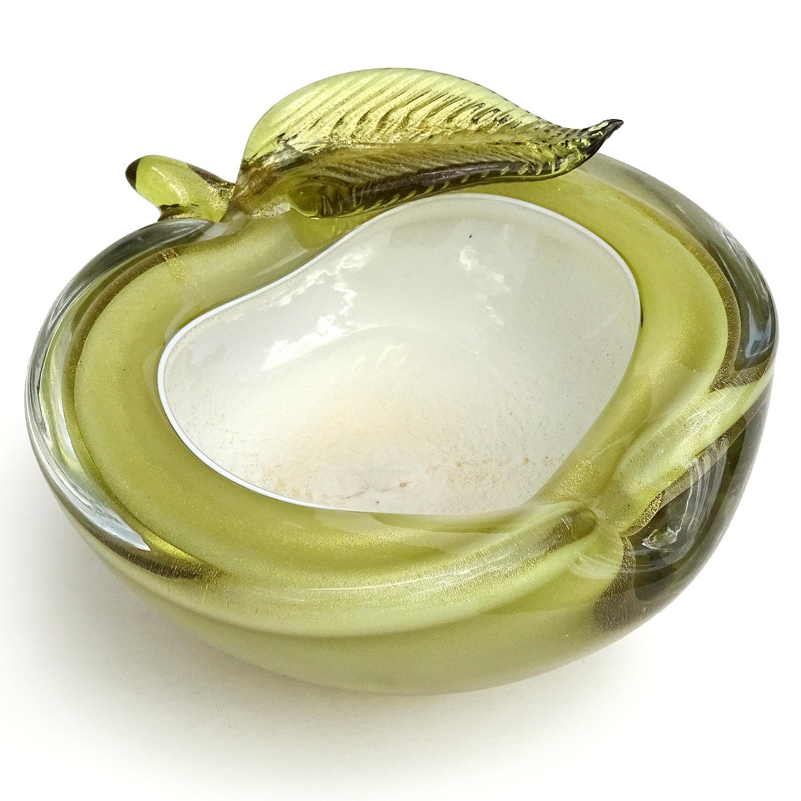 Beautiful vintage Murano hand blown olive green over white and gold flecks Italian art glass apple shaped bowl. Documented to Master glass artist and designer Alfredo Barbini, circa 1950-1960. Published in his vintage catalogs. The bowl is profusely