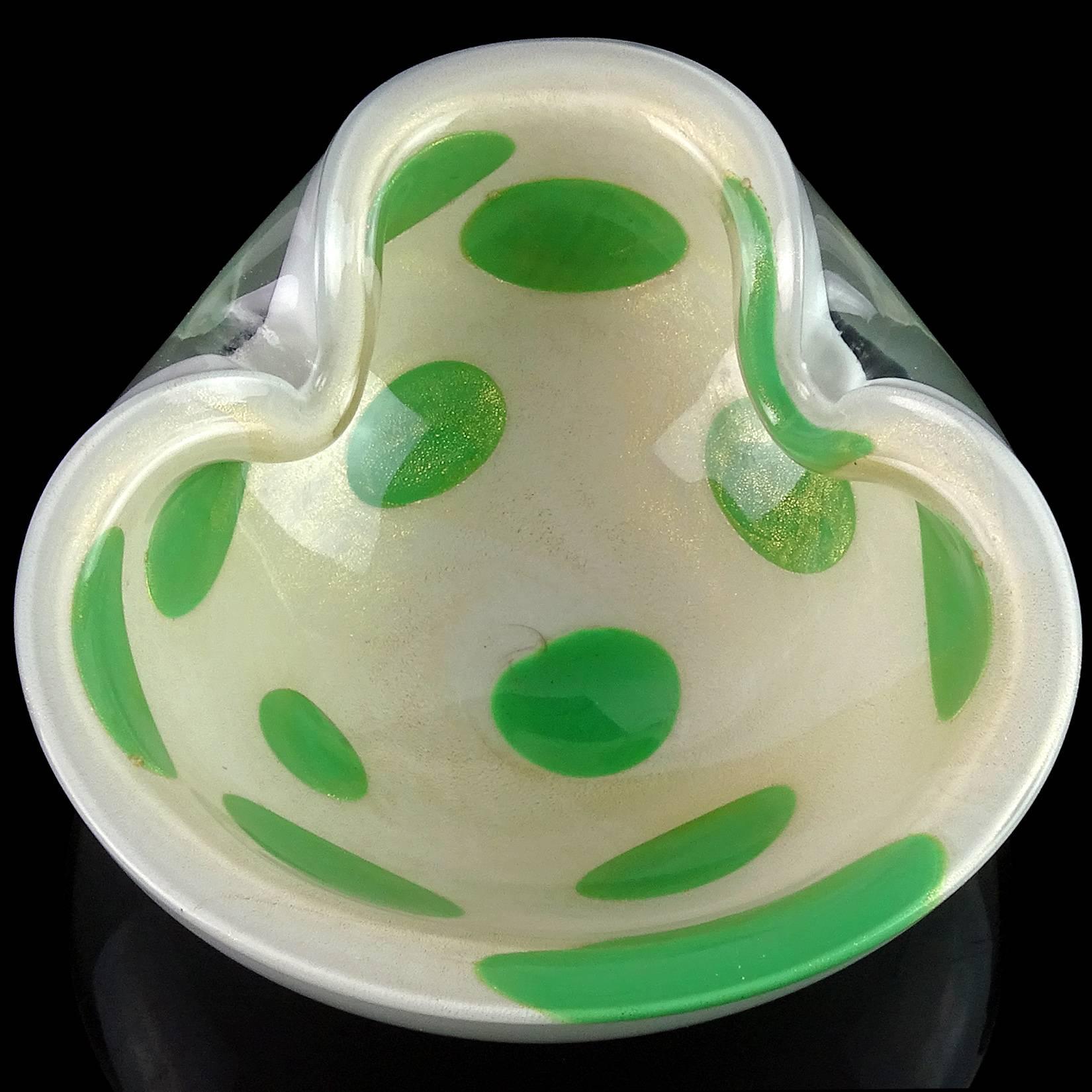 Beautiful Murano handblown white with green spots and gold flecks Italian art glass bowl / dish. Documented to designer Alfredo Barbini. Has heavy gold leaf on the inside of the bowl. Great shape, with two indents on the rim. Measures 6 1/4” x 6