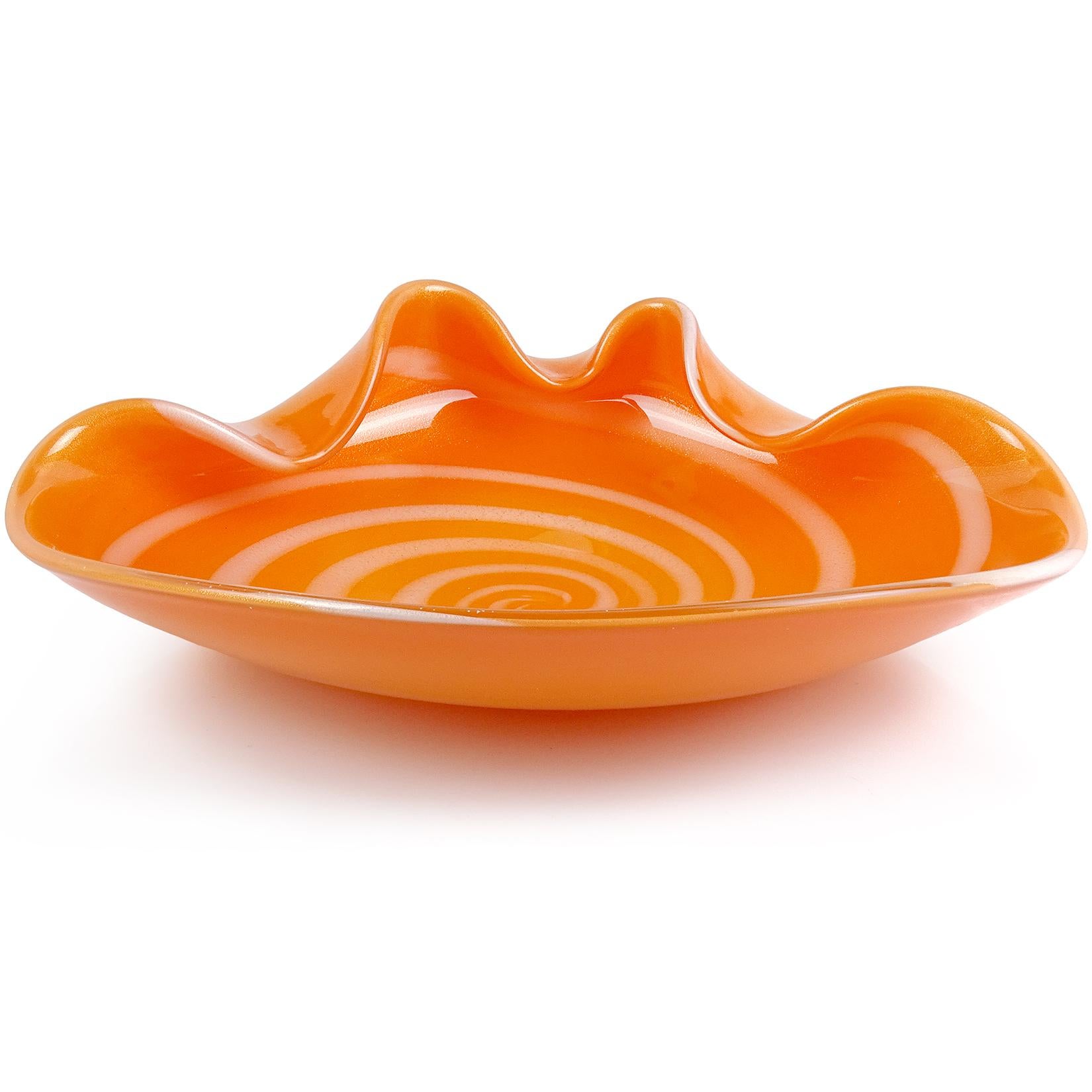 Beautiful large Murano hand blown right orange, white optic swirl and gold flecks Italian art glass bowl. Documented to designer Alfredo Barbini. The piece has folded over rim, and has heavy gold leaf throughout the inside. Measures: 12 1/2