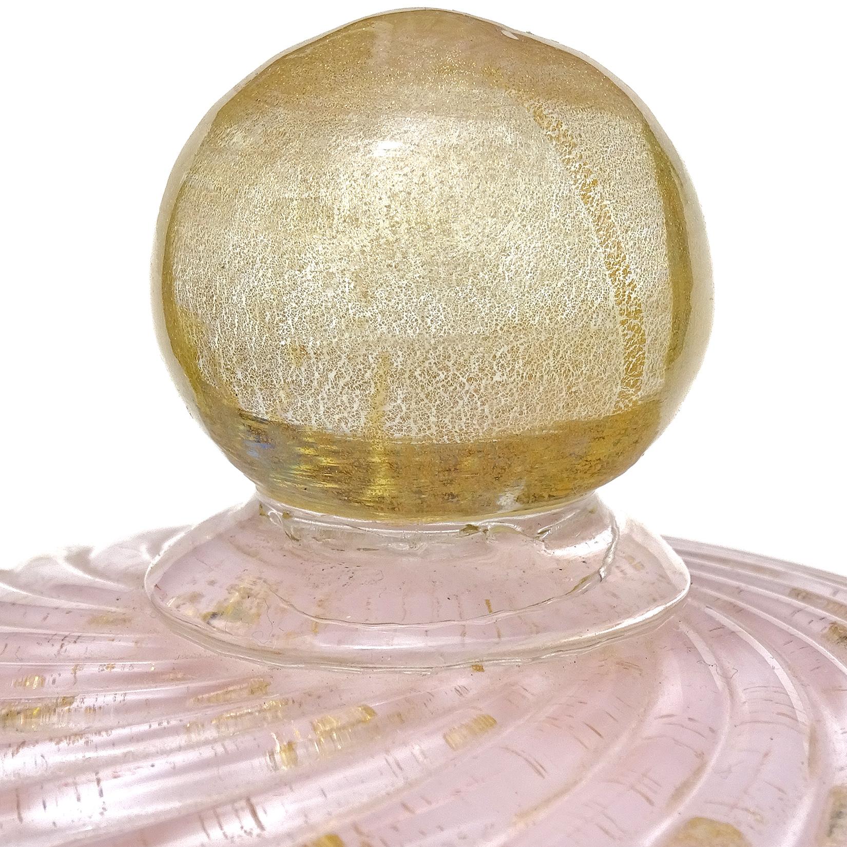 Beautiful vintage Murano hand blown pink, controlled bubbles and gold flecks Italian art glass cookie jar / container. Documented to designer Alfredo Barbini, circa 1950s. Published in his catalog. Please see reference photo on the listing. It is