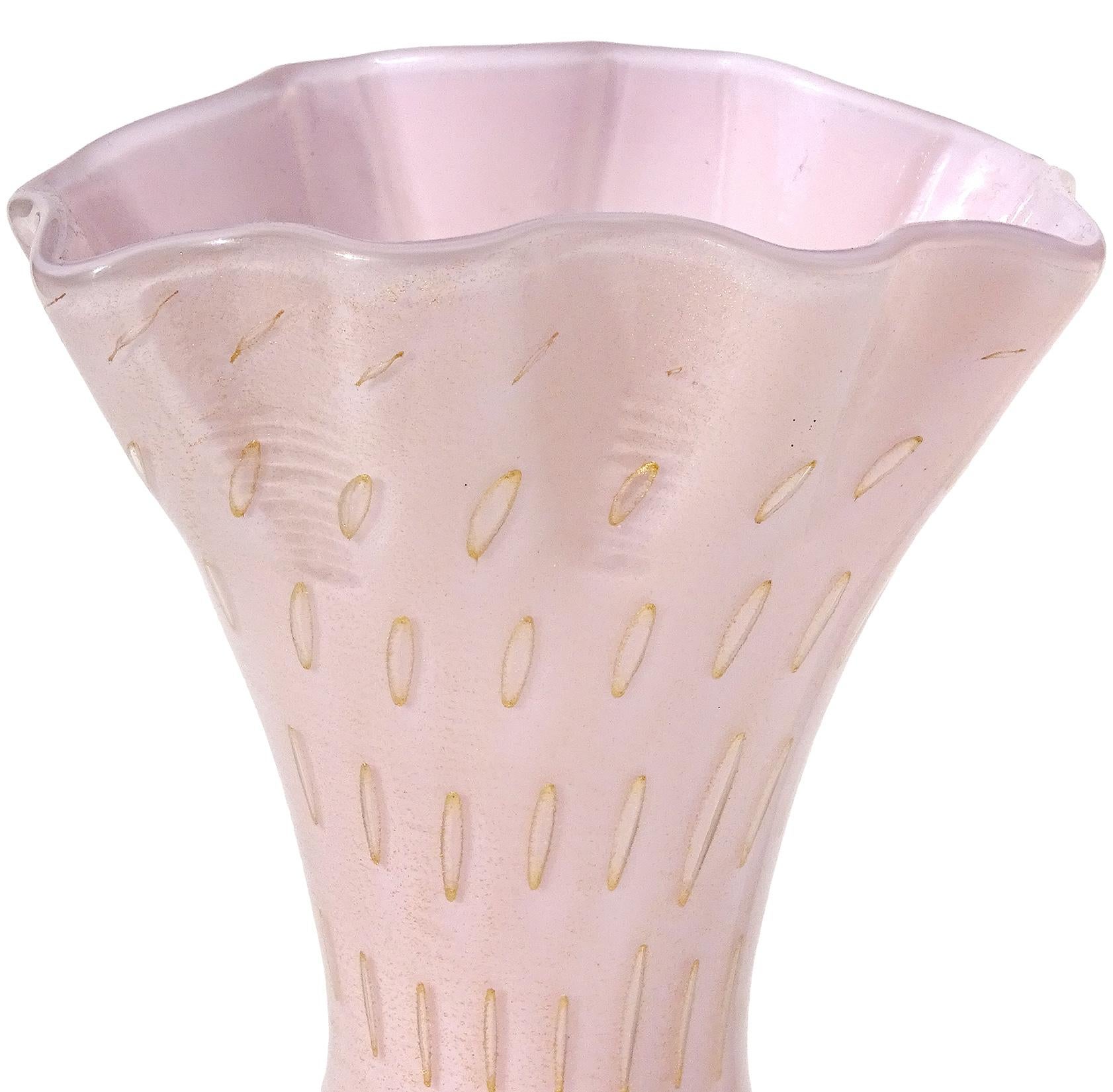 Beautiful vintage Murano hand blown pink, controlled bubbles and gold flecks Italian art glass flower vase. Documented to designer Alfredo Barbini. The gold leaf gathers around each bubble, making them really stand out. The rim is crimped and