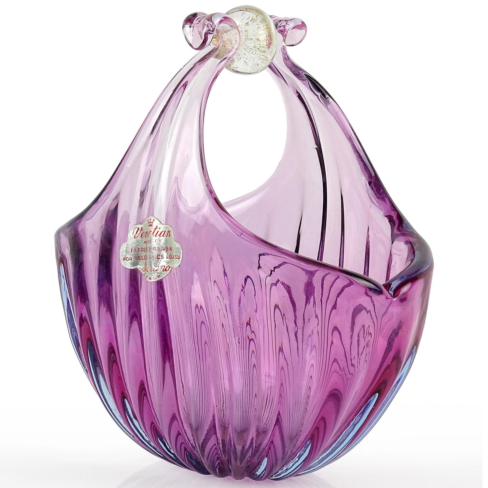Beautiful vintage Murano hand blown Sommerso purple with blue, and gold flecks Italian art glass flower basket / vase. Documented to designer Alfredo Barbini and published in his catalog, circa 1950-1960. Still retains original labels. It has 2