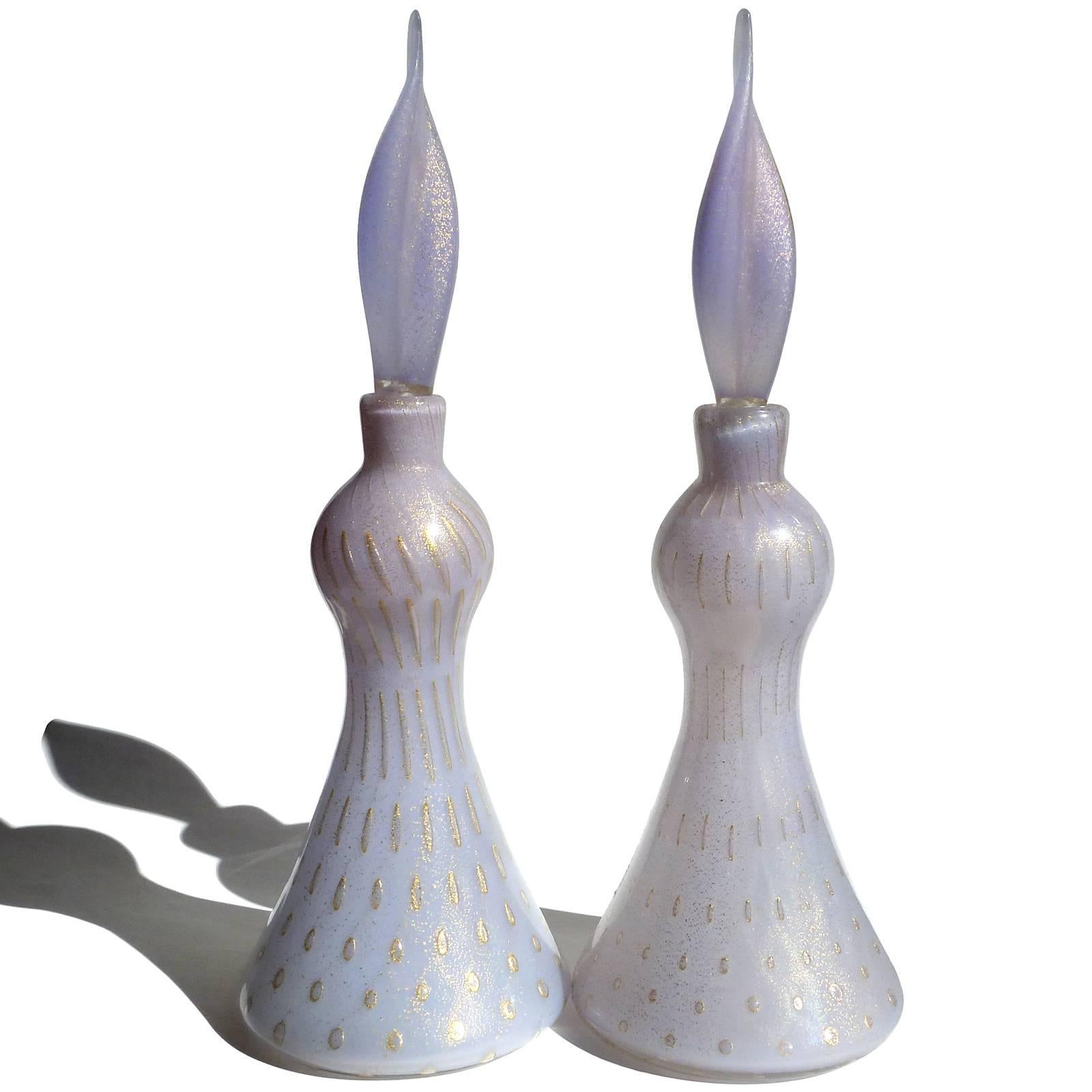 Priced per item (2 available as shown). Beautiful vintage Murano hand blown controlled bubbles, gold flecks and opal purple Italian art glass perfume bottle decanters. Documented to designer Alfredo Barbini, circa 1950s. The color of the bottles