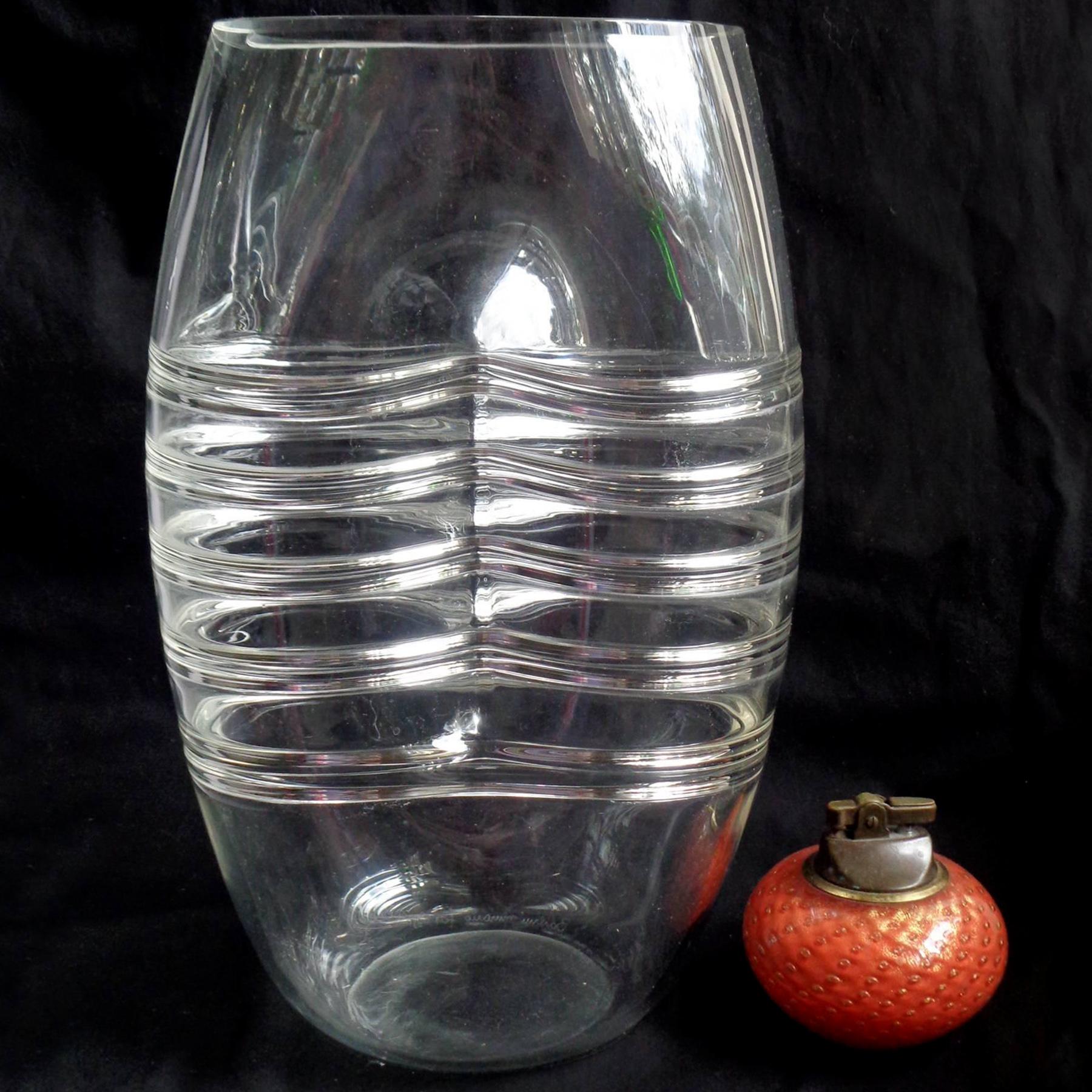 Beautiful and unusual, vintage Murano hand blown crystal clear, indented and ribbed Italian art glass flower vase. Documented to designer Alfredo Barbini, circa 1960-1970s. The vase is signed 