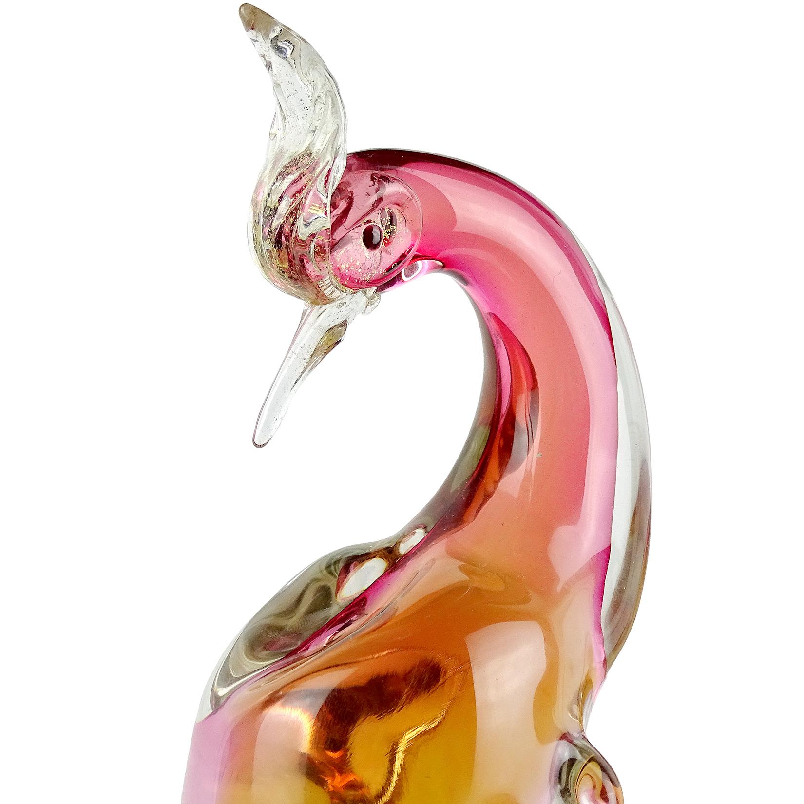 Beautiful, large vintage Murano hand blown Sommerso cranberry to yellow, and gold flecks Italian art glass pheasant / bird of paradise sculptures. Documented to designer Alfredo Barbini. The birds are beautifully sculpted and profusely filled with