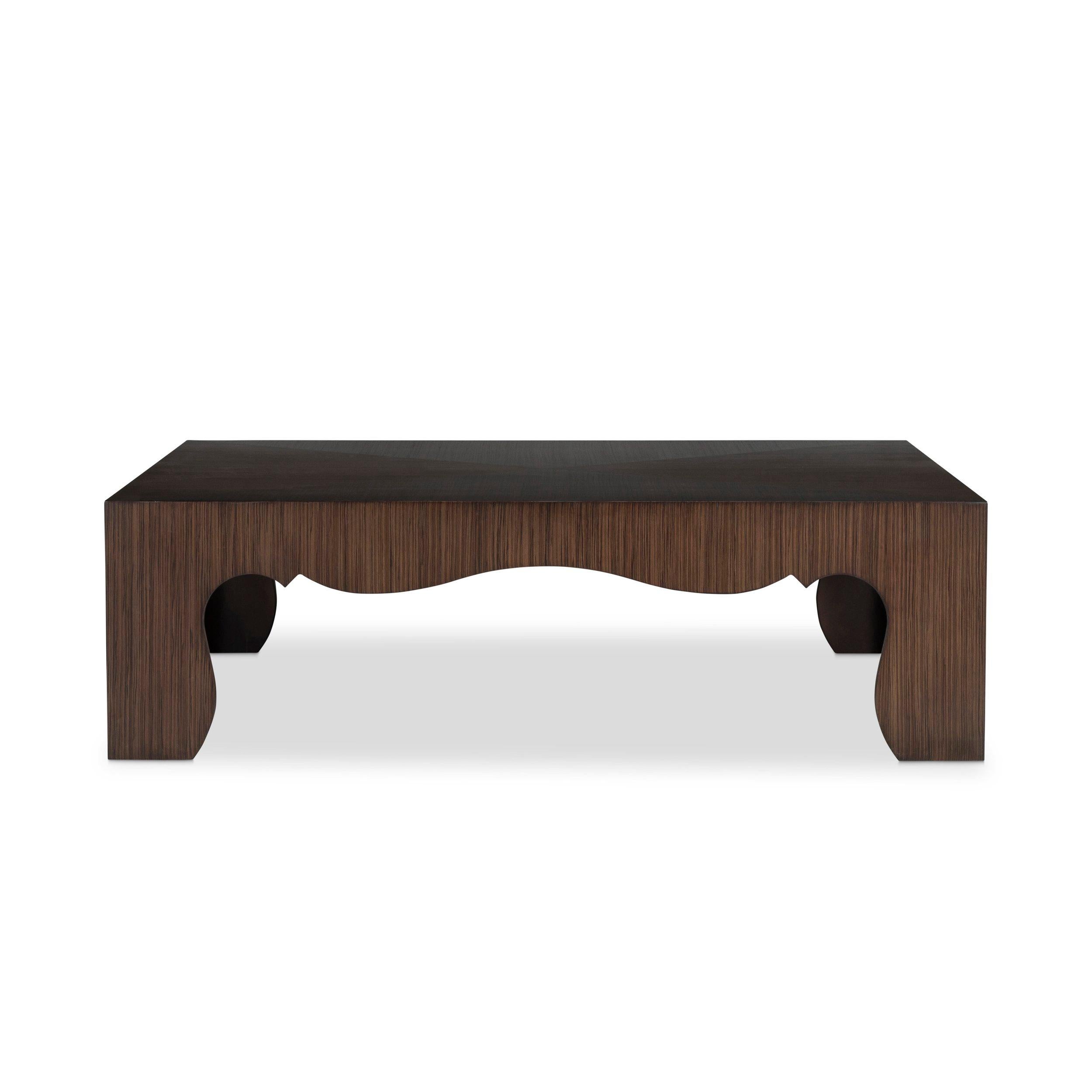 A nineteen forties inspired, elegant square or rectangular coffee table. Linear matched zebrawood veneer radiates from the center of the table and waterfalls over the dramatically scalloped aprons.

Zebrano veneer grain has a ribbon figure, the