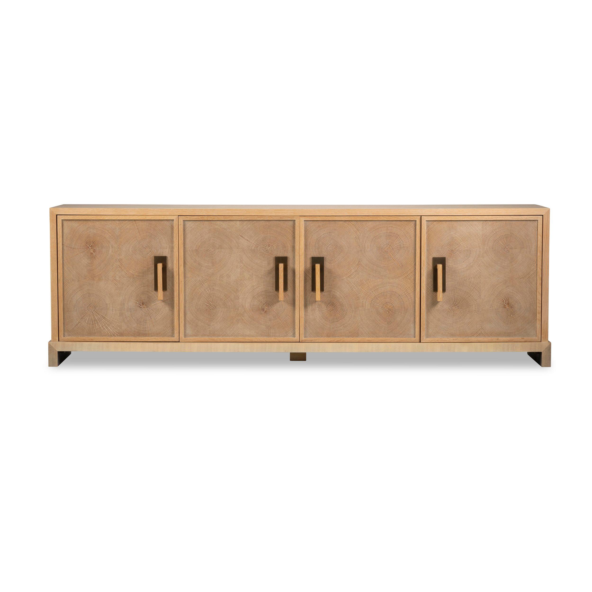 A handsome multifunctional cabinet that can work in many rooms.

The clean, mitered, architectural case features panels of patterned oyster veneer in the doors, and inside shelves and 2 drawers provide convenient storage.

- Oak and Walnut Veneers,
