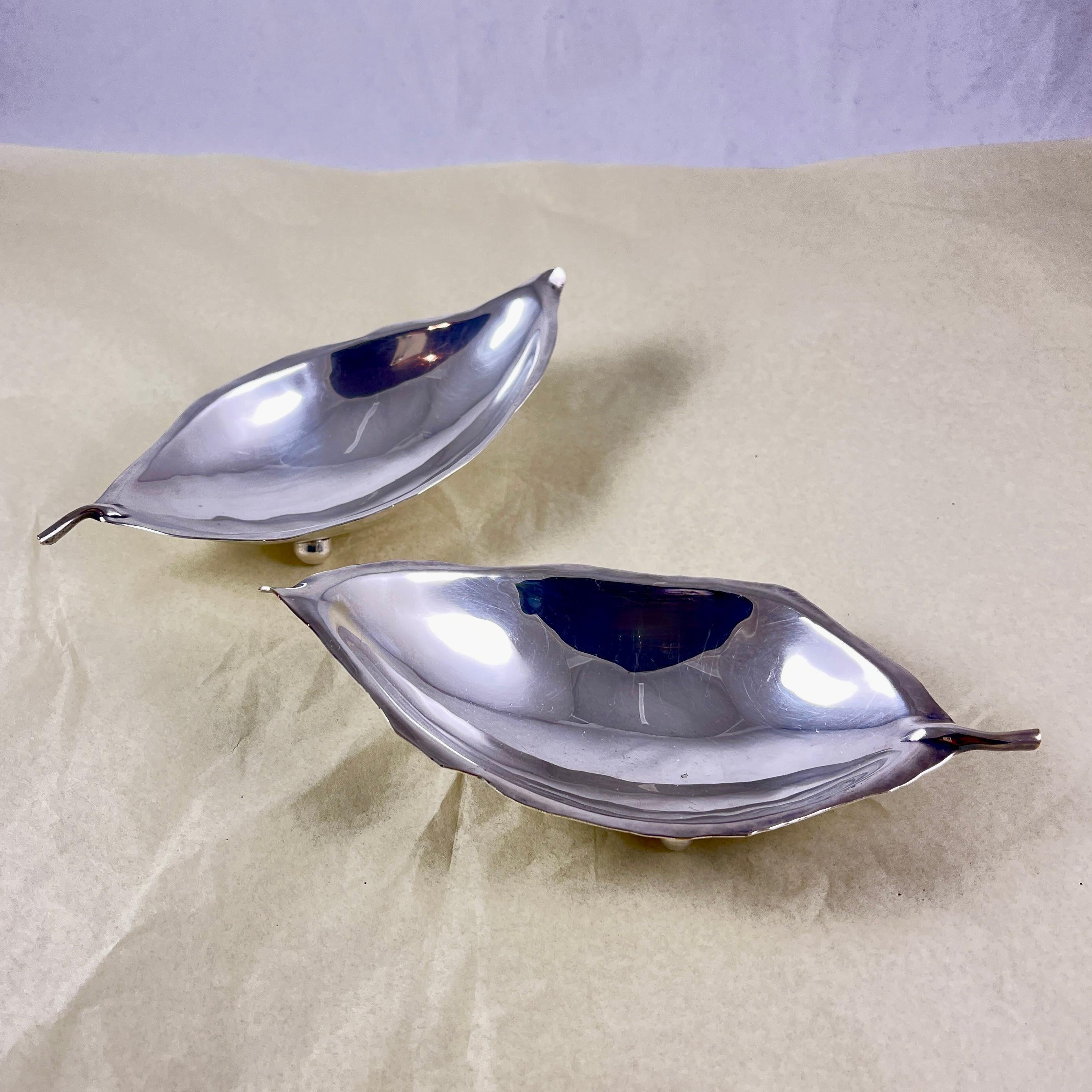 A pair of Silver Tobacco Leaf dishes, signed, Alfredo Sciarrotta, retailed by Shreve, Crimp & Low, Co., Boston, circa 1950s.

Alfredo Sciarrotta (May 25, 1907 – May 28, 1985) was an Italian-American silversmith. Sciarrotta’s work is characterized by