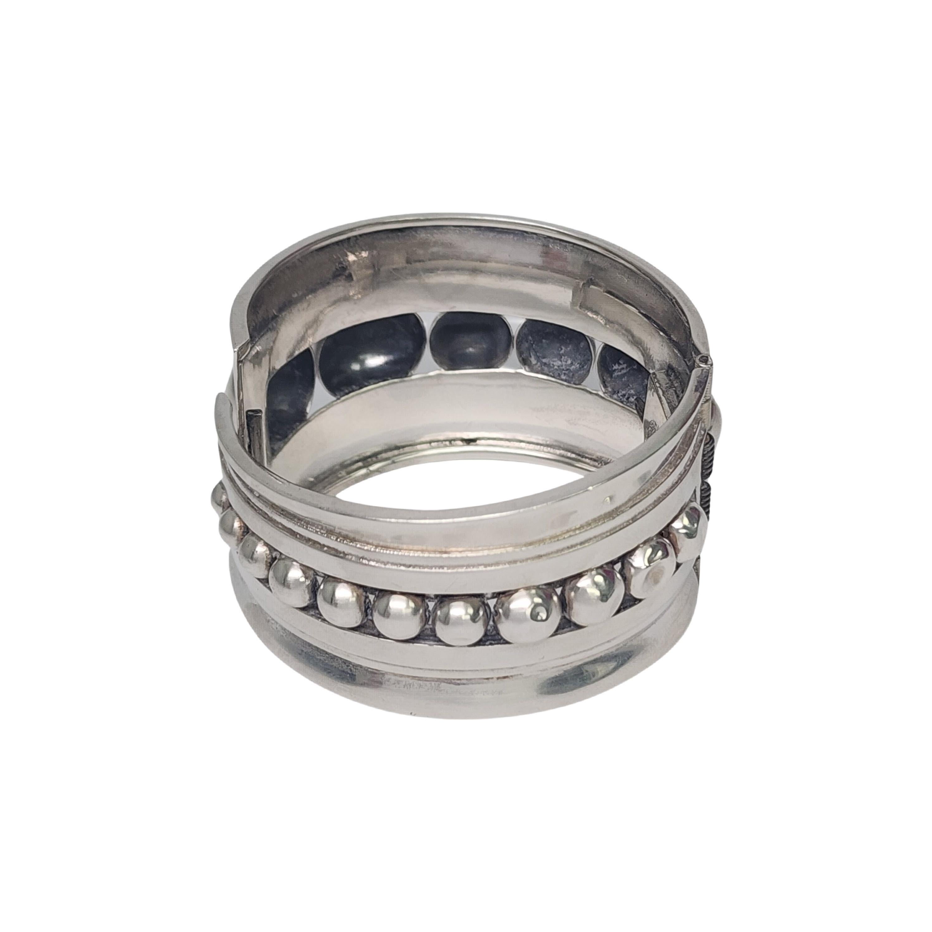 Sterling silver clamper bracelet by Alfredo Villasana of Mexico.

Wide and substantial hinged clamper bracelet with a graduated bead design. 

Weighs approx 74.0g, 47.6dwt

Measures approx 6 3/4